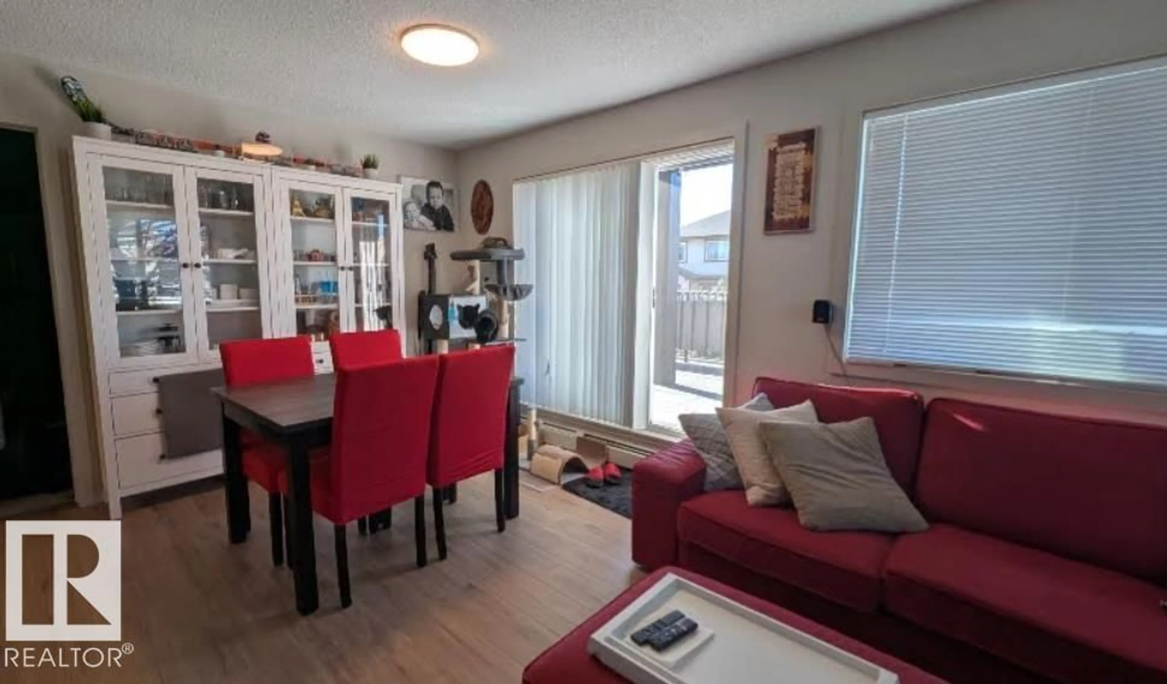 Living room with furniture, wood/laminate floor for 120 - 5404 7 AV, Edmonton Alberta T6X2X4