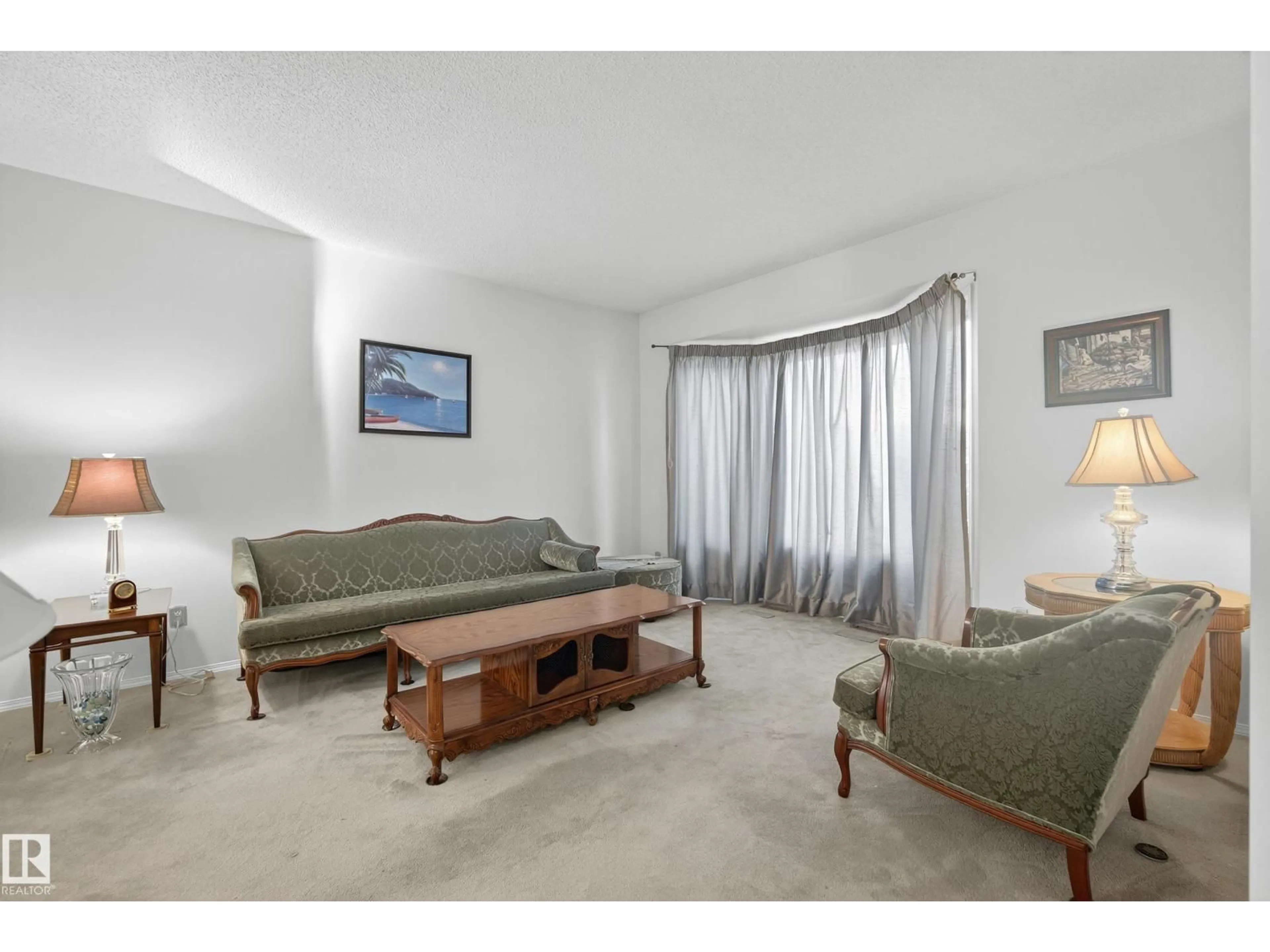 Living room with furniture, carpet floor for 9807 154 AV, Edmonton Alberta T5X5R2