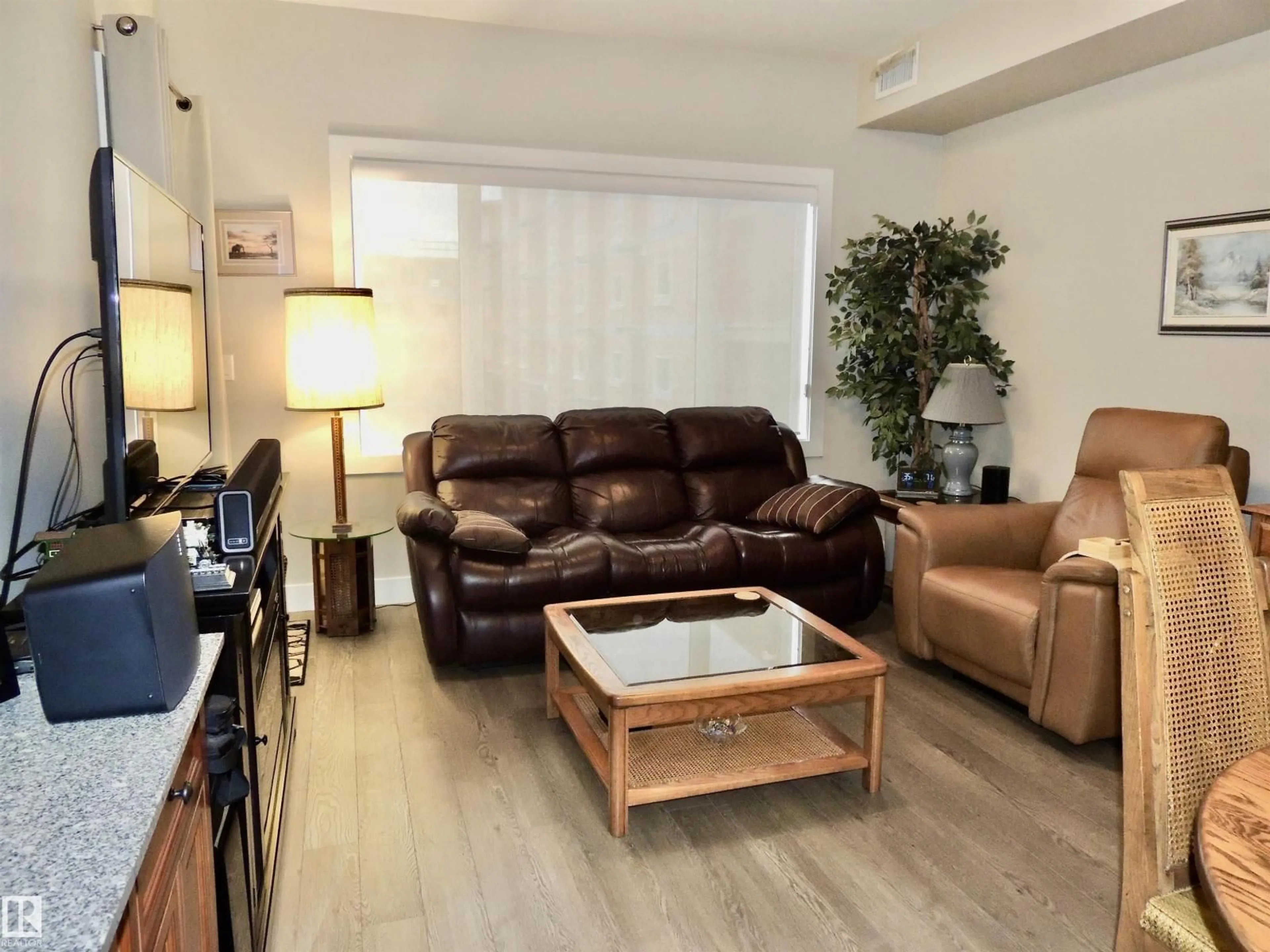 Living room with furniture, wood/laminate floor for 5001 - 412 ETON BV, Sherwood Park Alberta T8H0N7