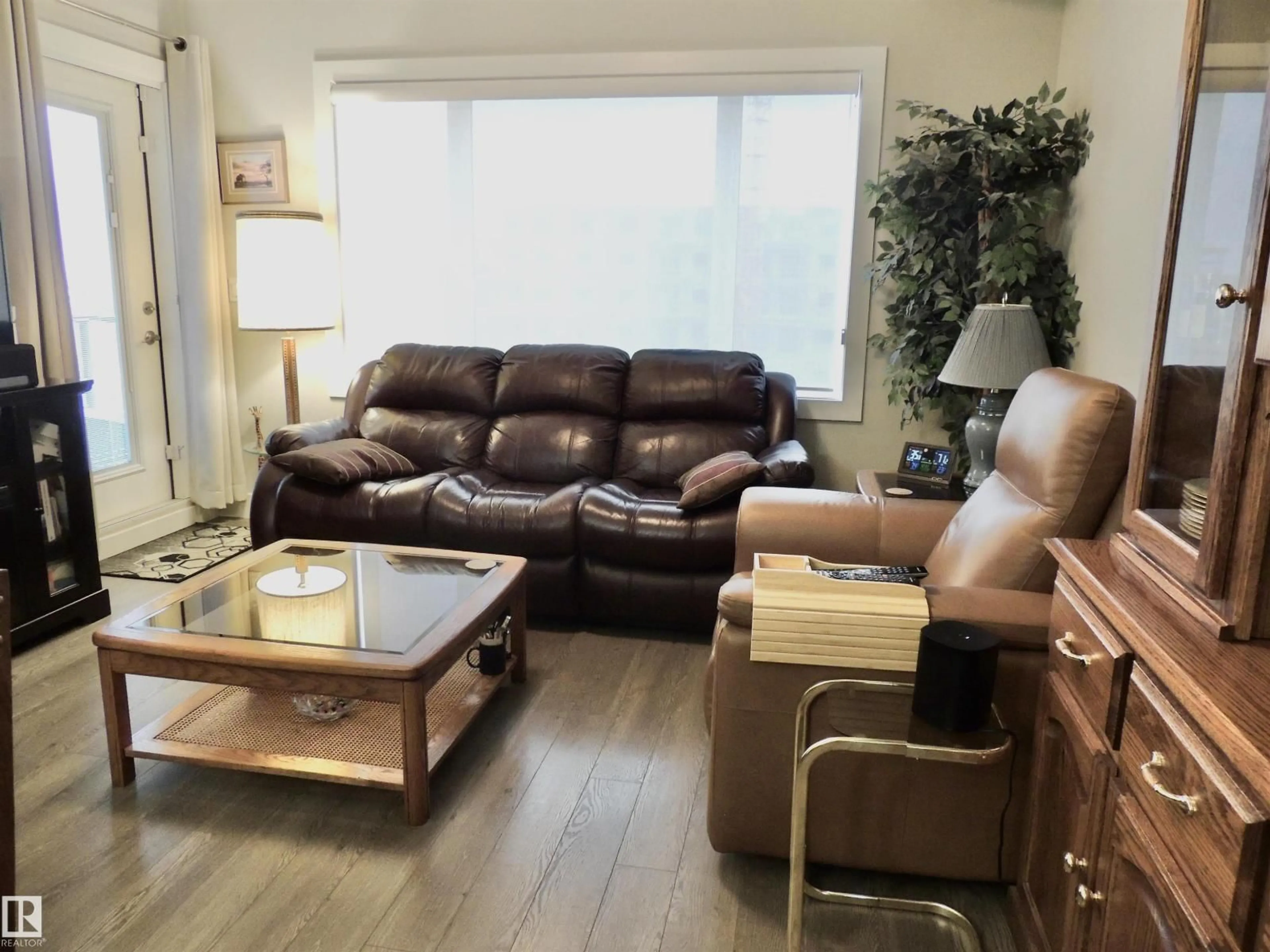 Living room with furniture, wood/laminate floor for 5001 - 412 ETON BV, Sherwood Park Alberta T8H0N7