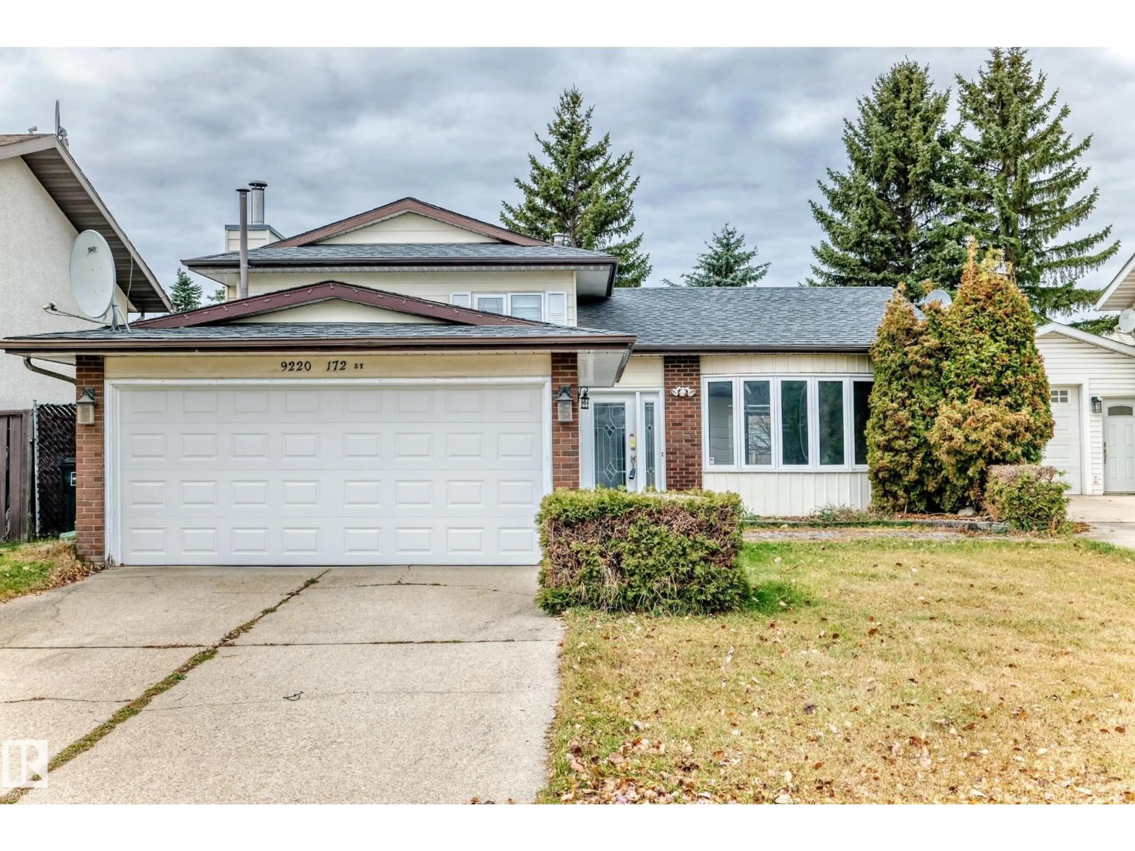 Home with vinyl exterior material, street for NW - 9220 172 ST, Edmonton Alberta T5T3G2