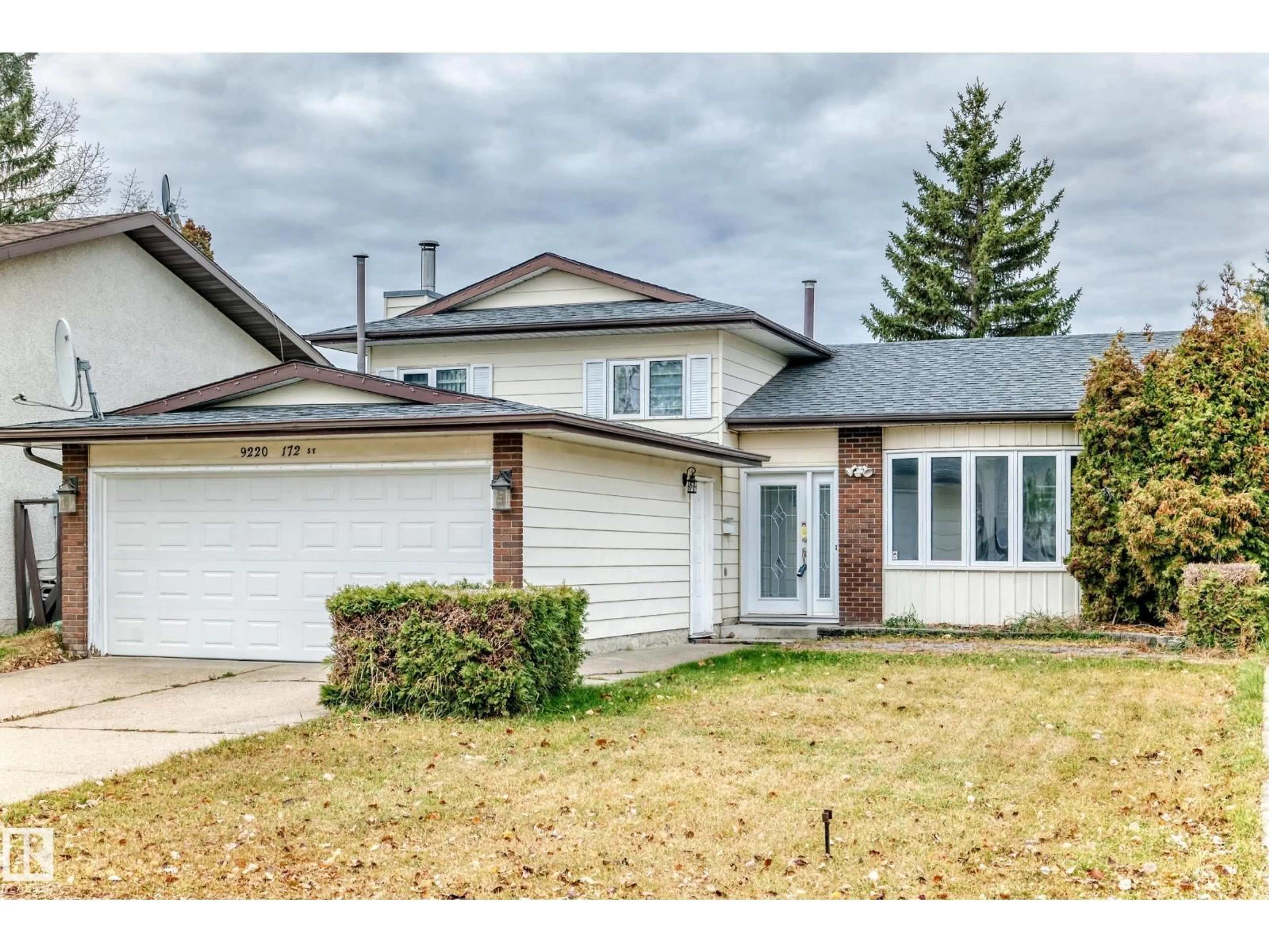 Home with vinyl exterior material, street for NW - 9220 172 ST, Edmonton Alberta T5T3G2