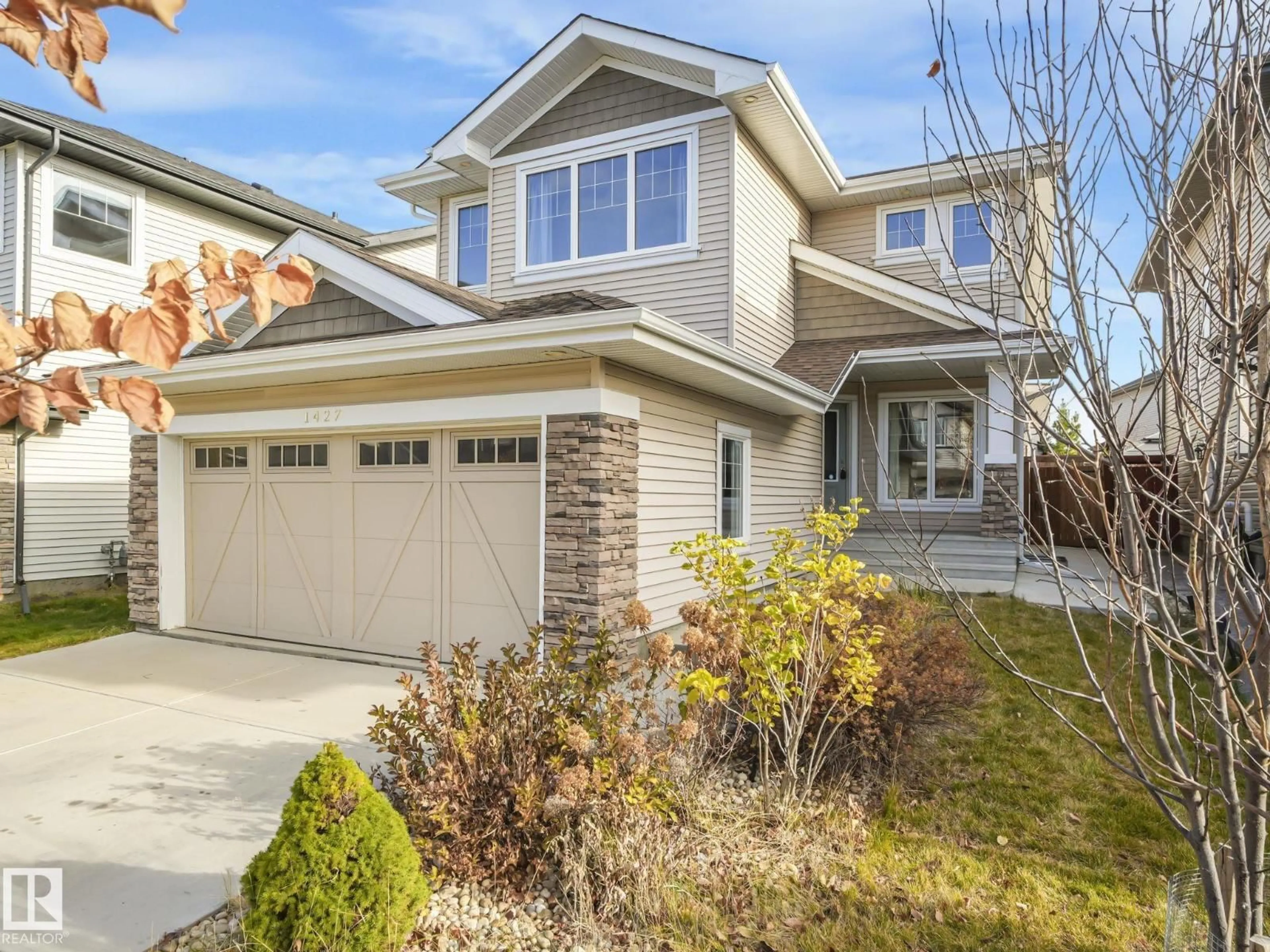 Home with vinyl exterior material, street for SW - 1427 161 ST, Edmonton Alberta T6W3P4