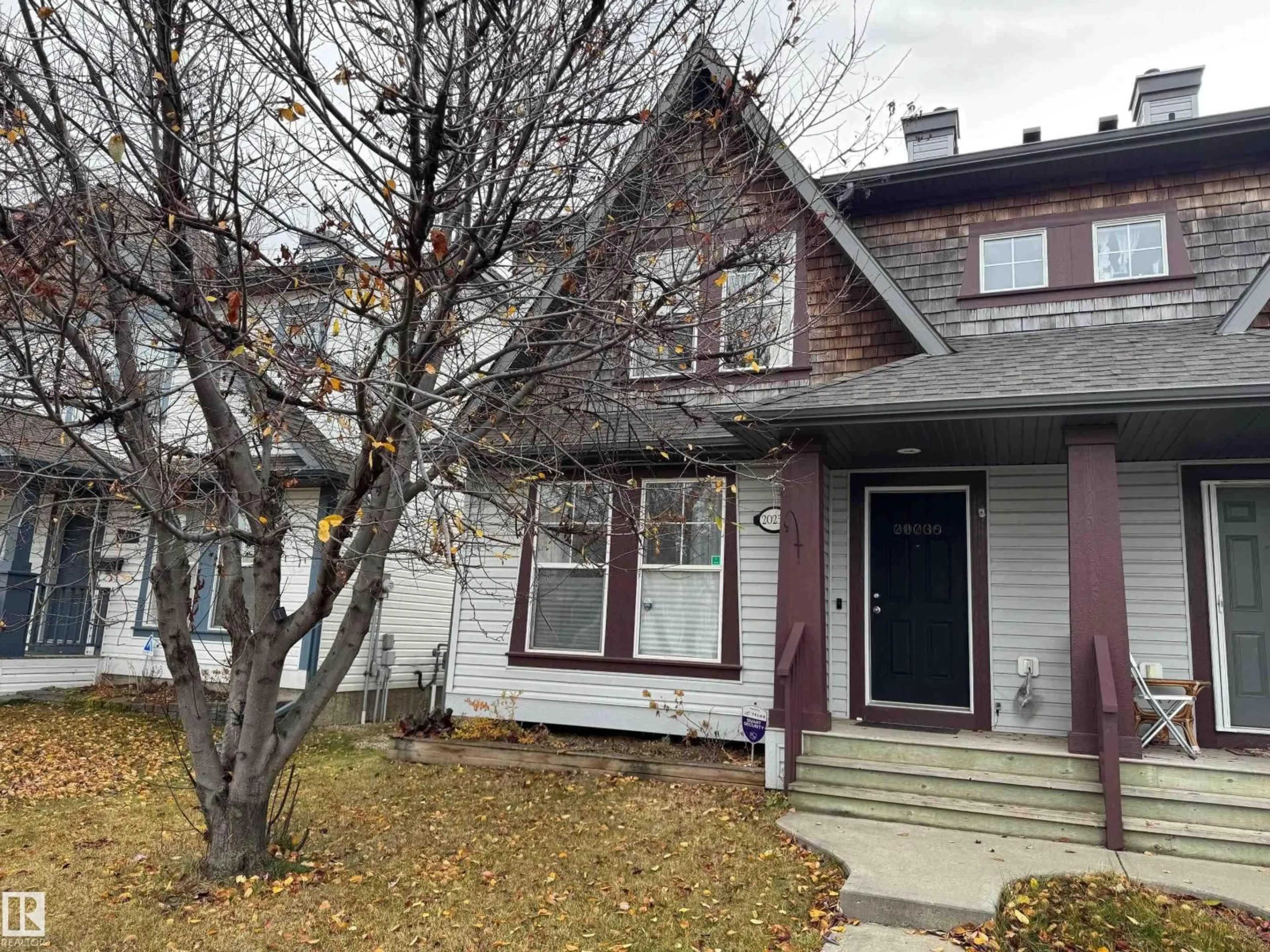 Home with vinyl exterior material, street for 20235 56 AV, Edmonton Alberta T6M0B3