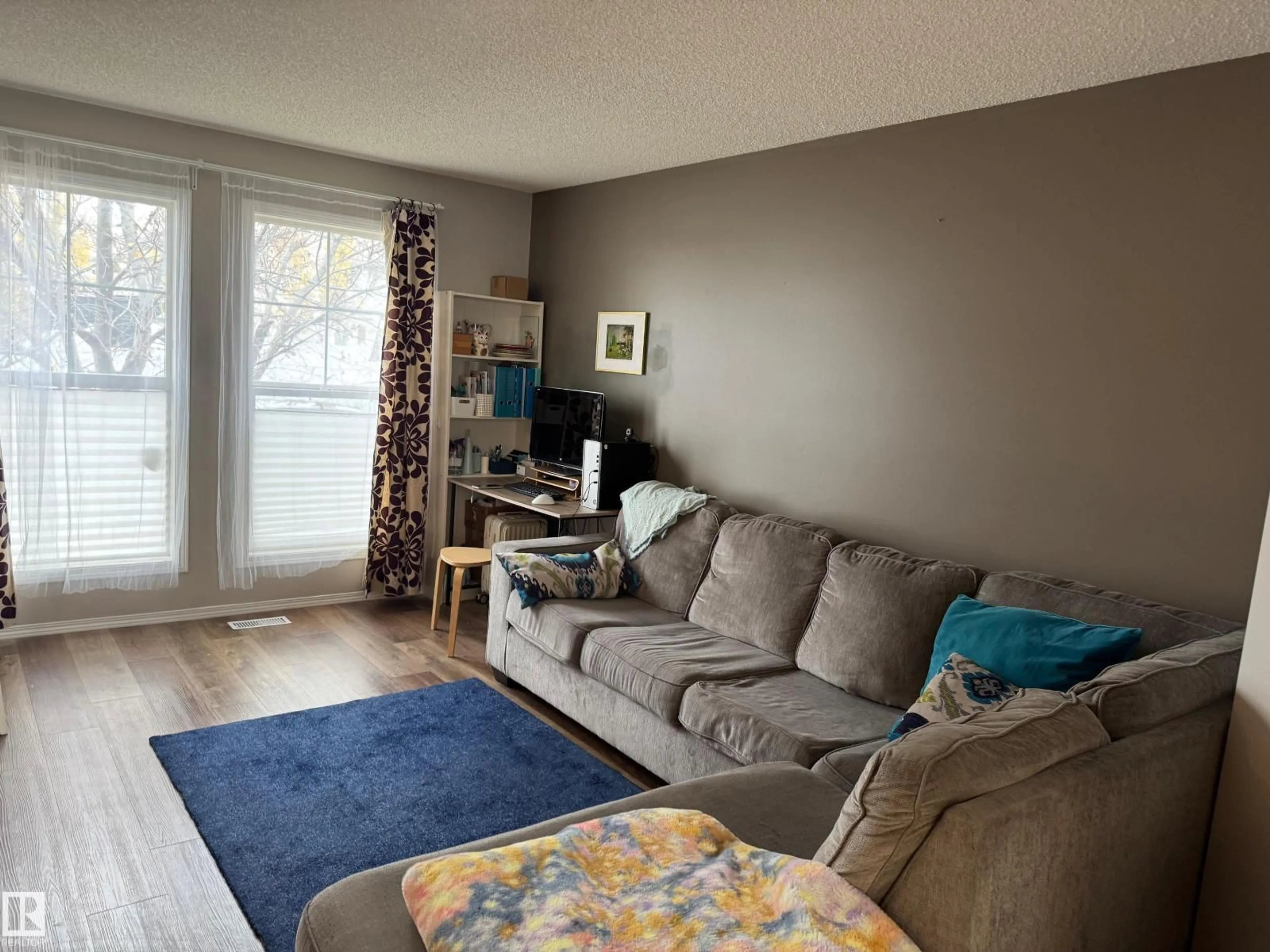 Living room with furniture, unknown for 20235 56 AV, Edmonton Alberta T6M0B3