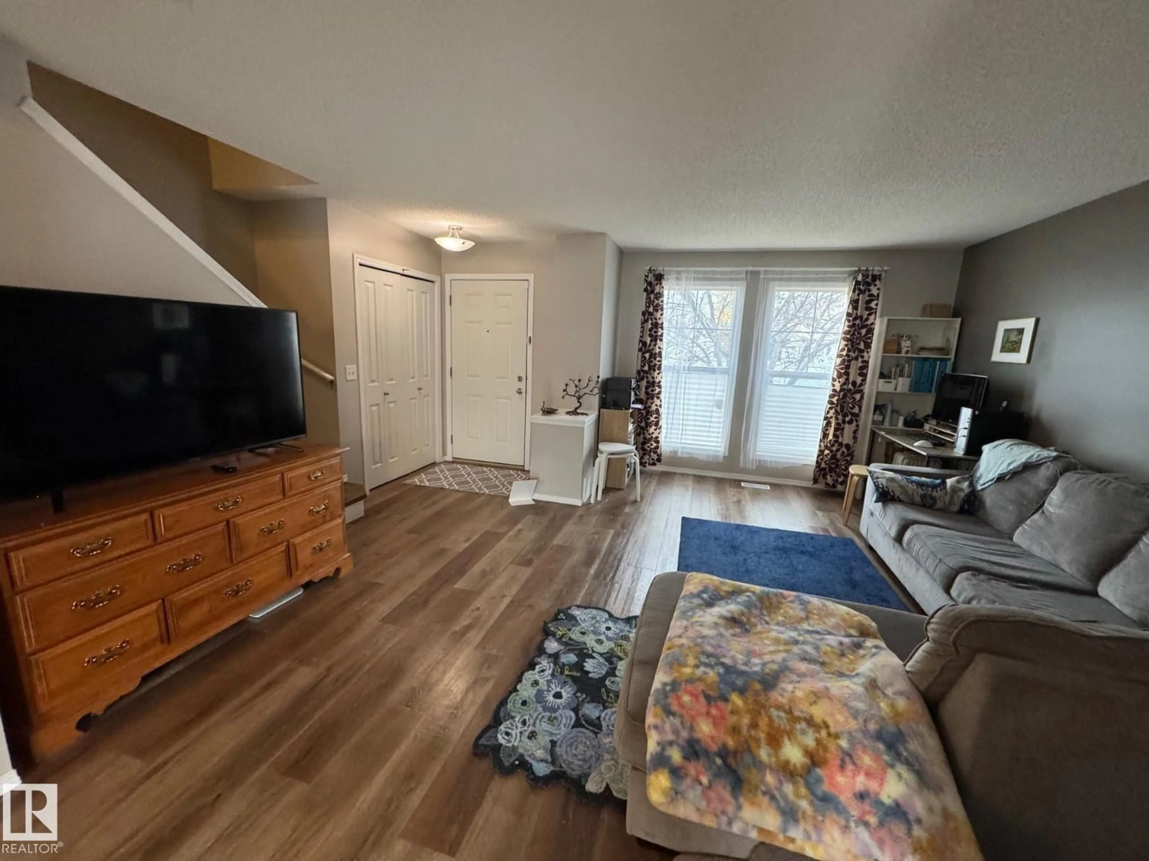 Living room with furniture, unknown for 20235 56 AV, Edmonton Alberta T6M0B3