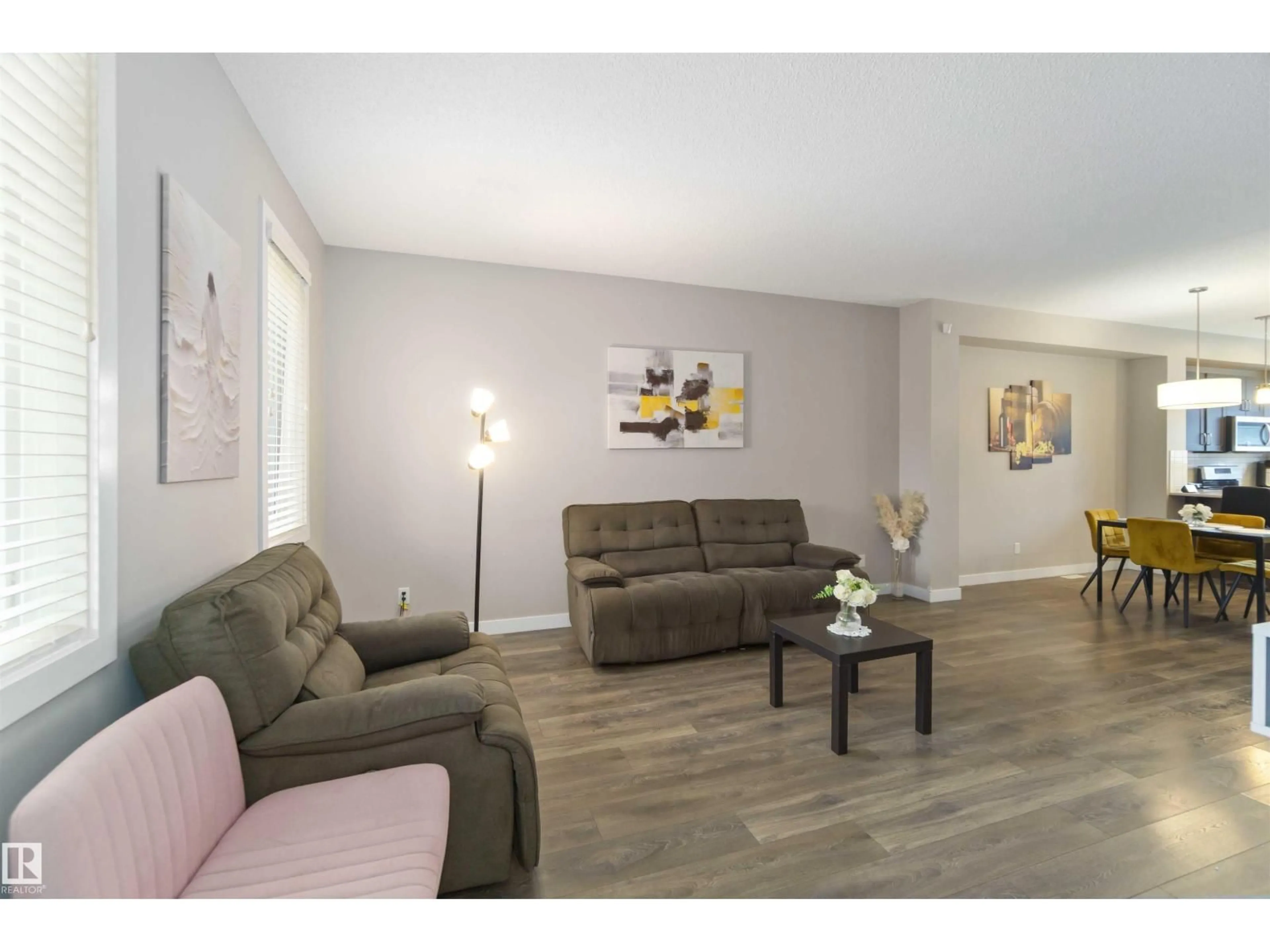 Living room with furniture, wood/laminate floor for 392 CHARLESWORTH DR, Edmonton Alberta T6X2G5