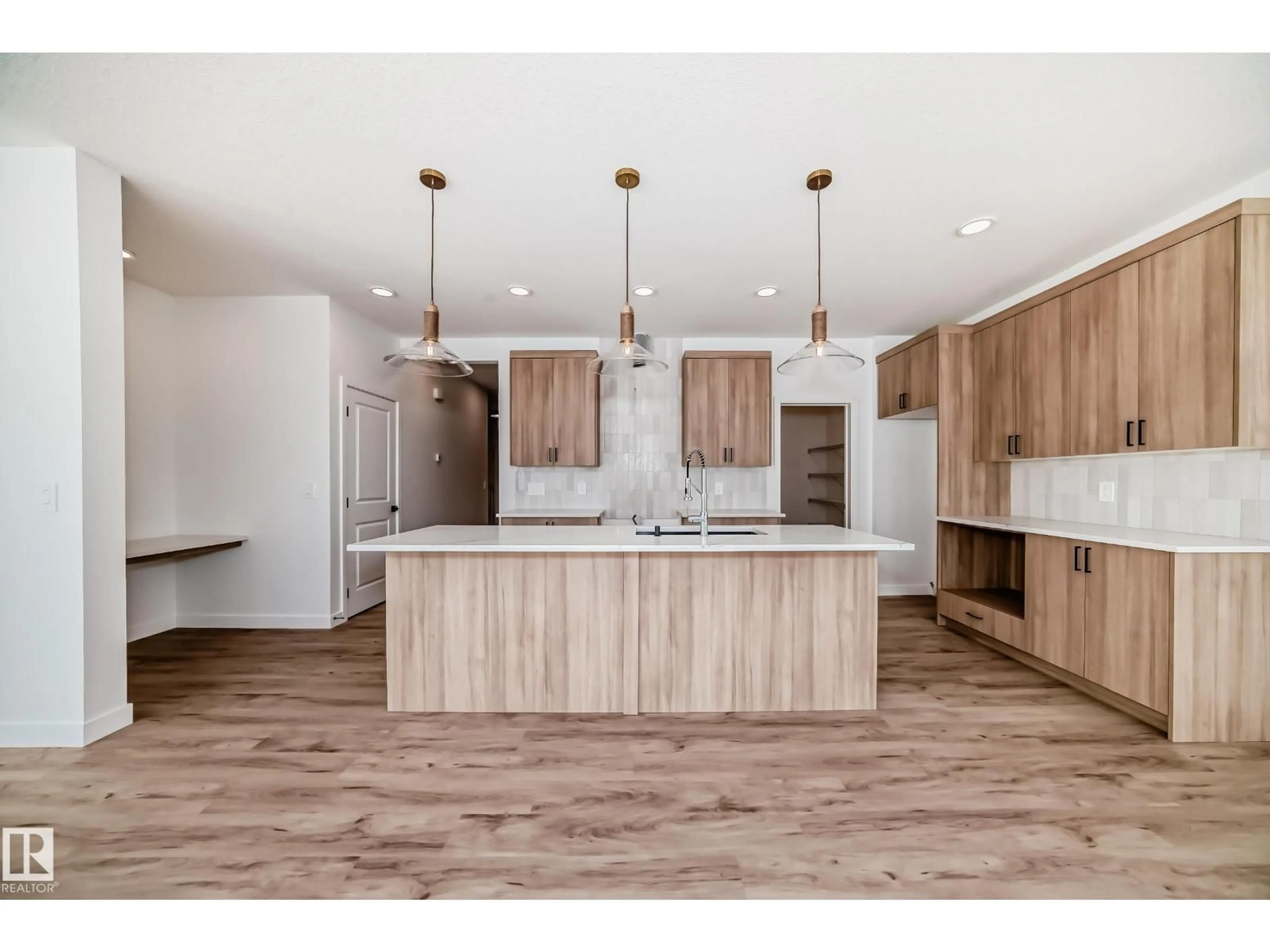 Open concept kitchen, wood/laminate floor for SW - 8215 KIRIAK LO, Edmonton Alberta T6W5S2