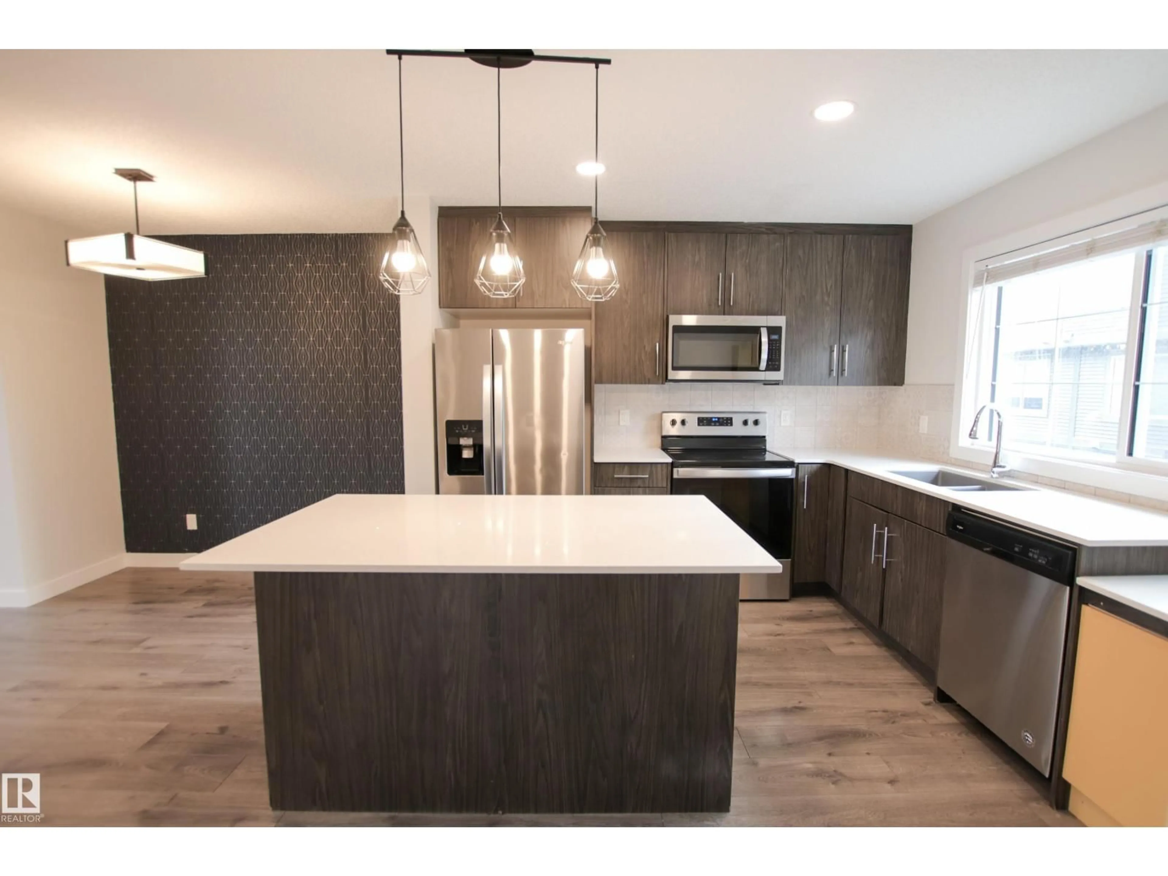 Open concept kitchen, unknown for #38 - 3025 151 AV, Edmonton Alberta T5Y3W4