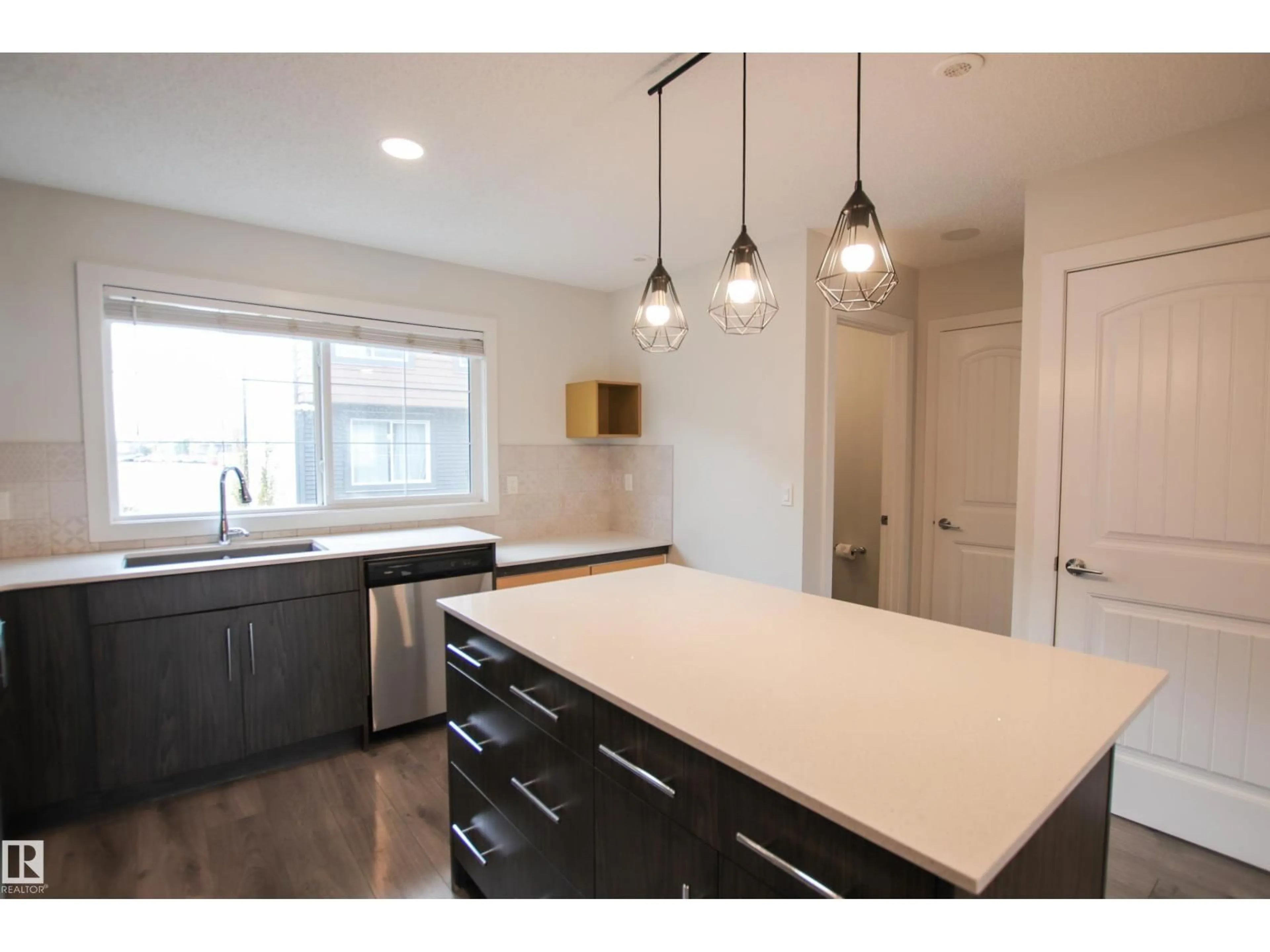 Open concept kitchen, unknown for #38 - 3025 151 AV, Edmonton Alberta T5Y3W4