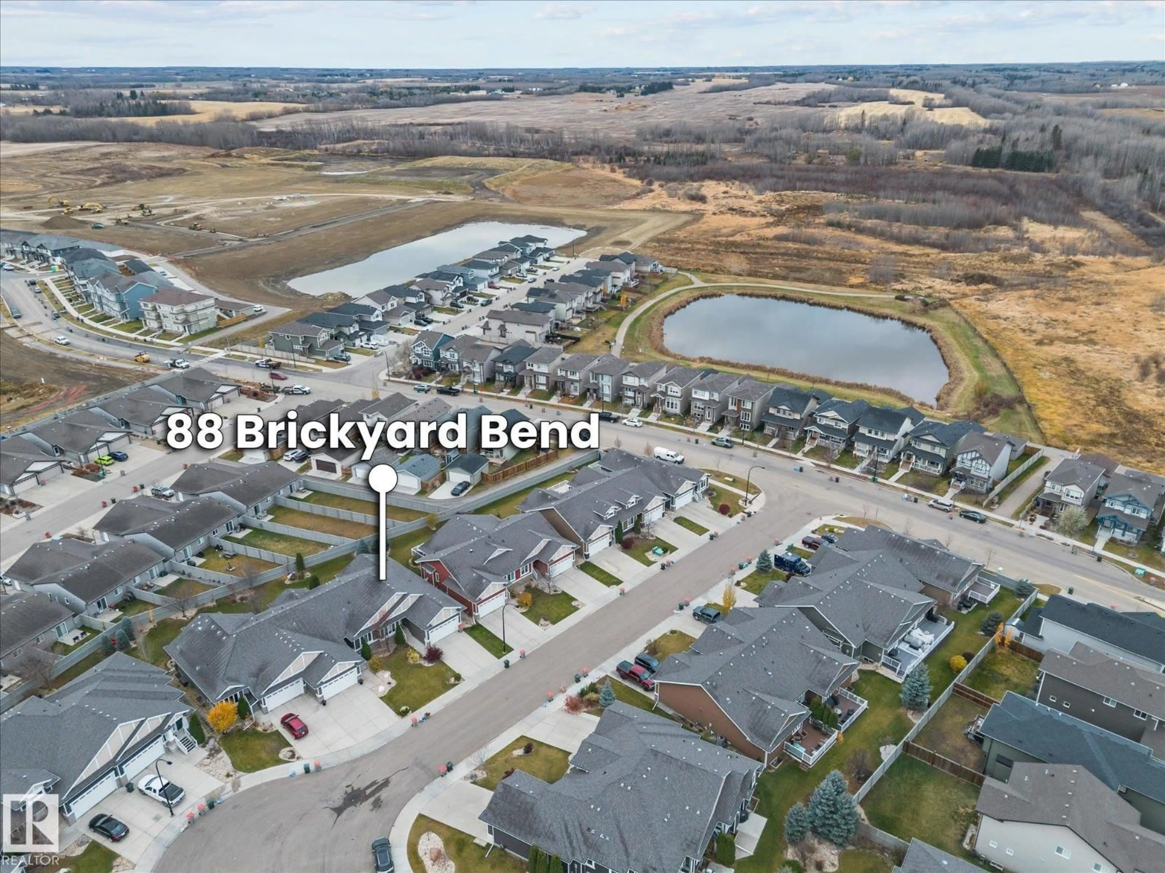 A pic from outside/outdoor area/front of a property/back of a property/a pic from drone, water/lake/river/ocean view for 88 BRICKYARD BN, Stony Plain Alberta T7X0H9