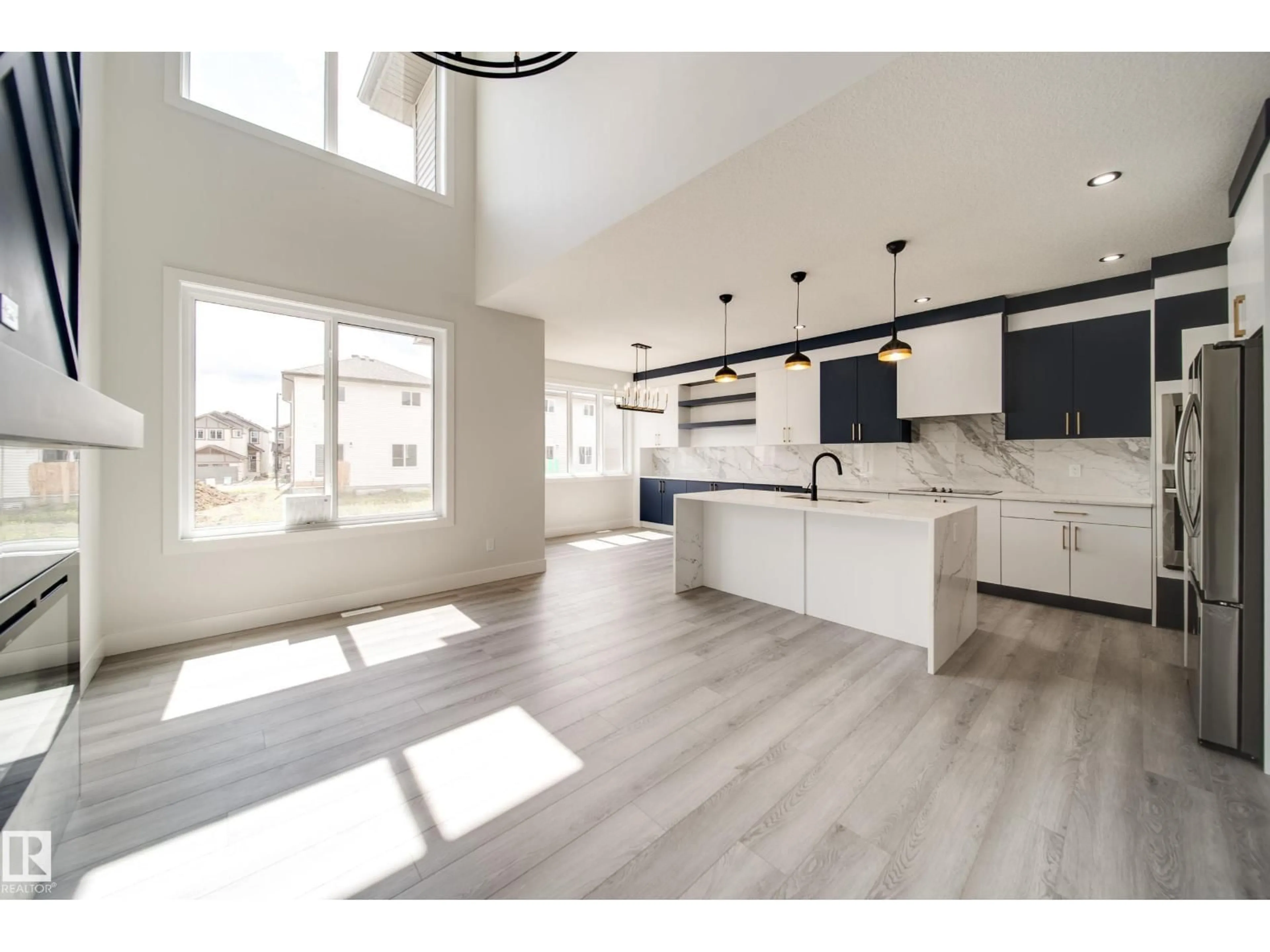 Open concept kitchen, wood/laminate floor for 8747 183 AV, Edmonton Alberta T5Z0S8