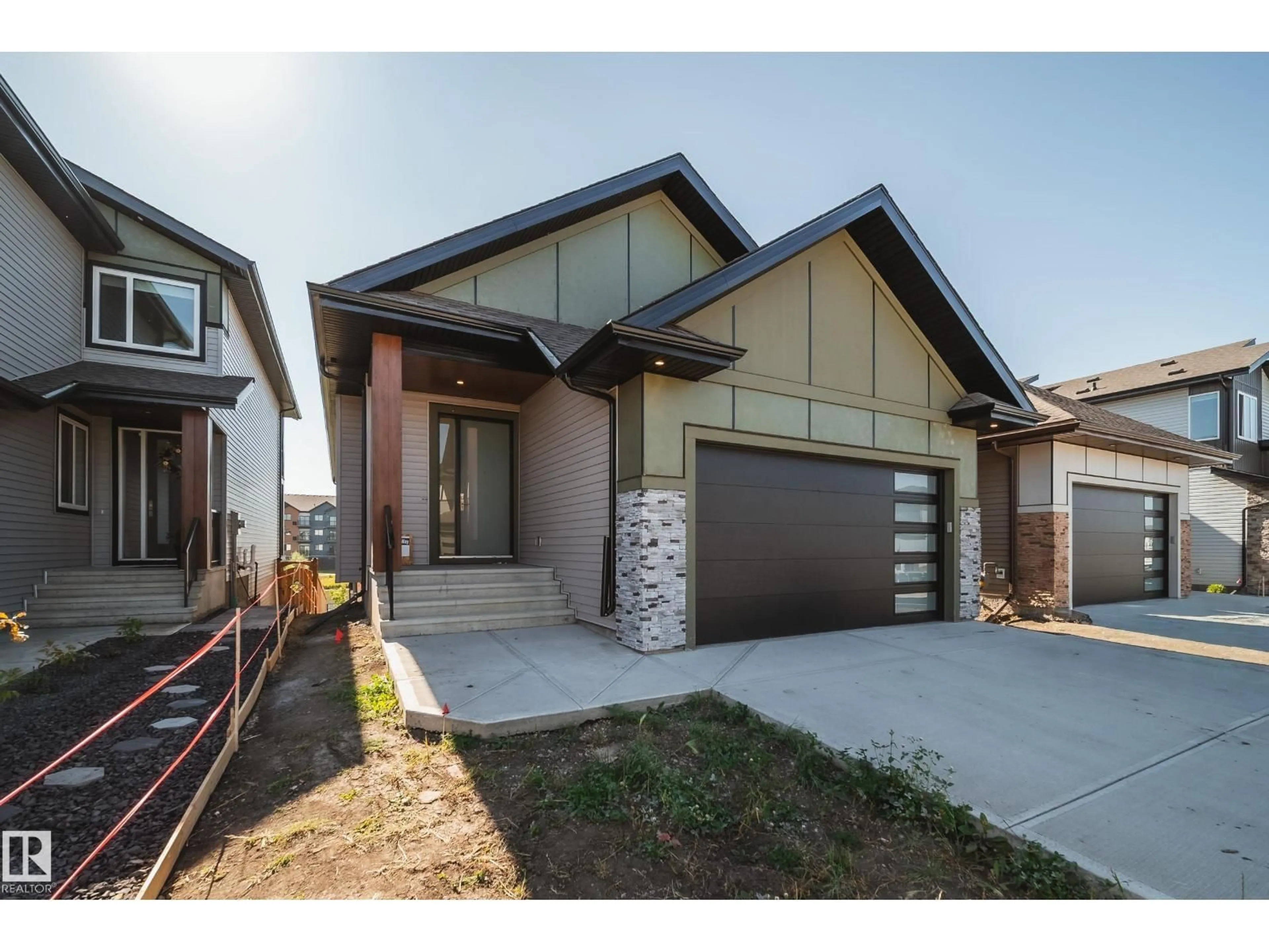 Home with brick exterior material, street for 21 STARLING WY, Fort Saskatchewan Alberta T8L1R5