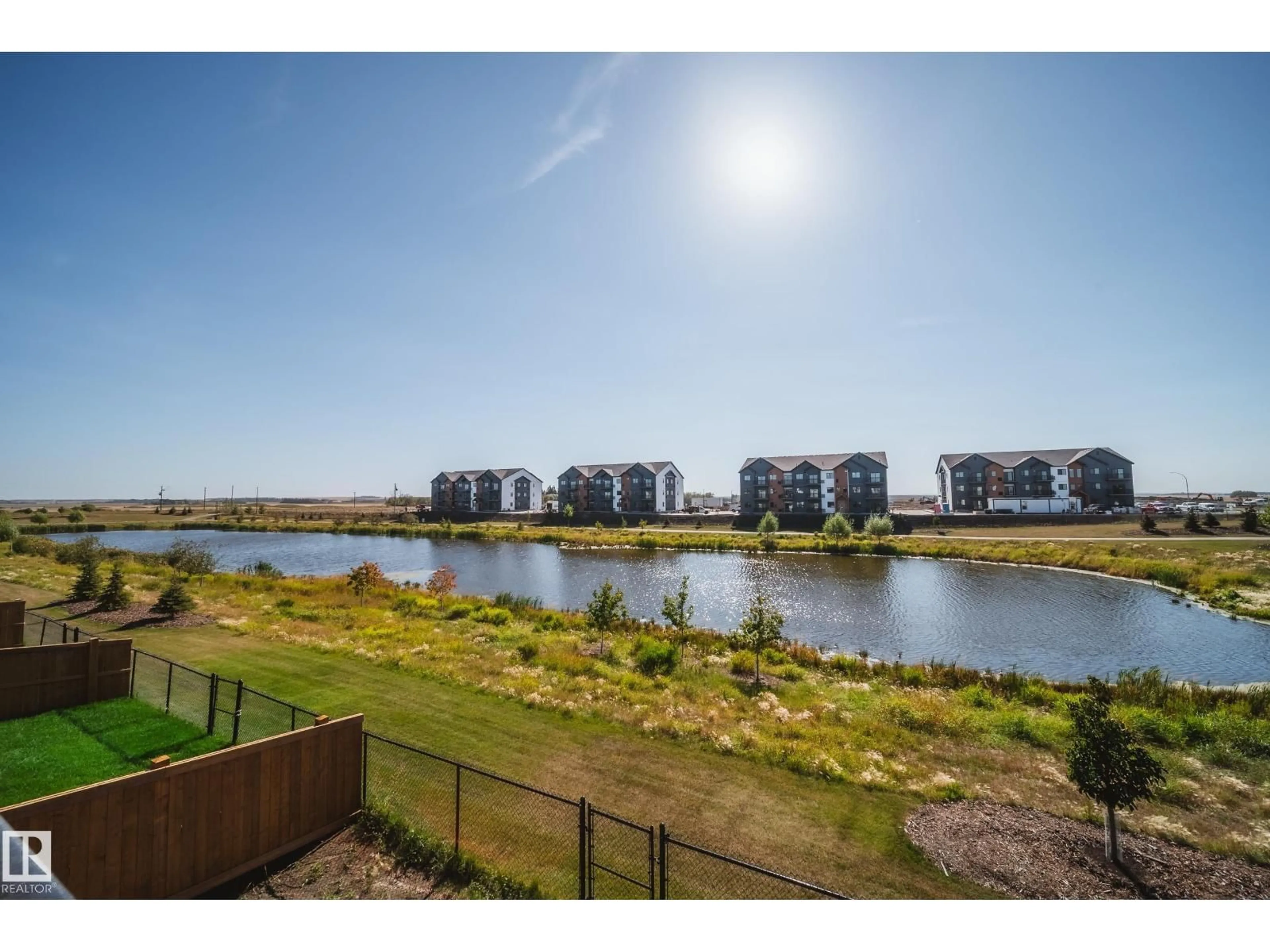 A pic from outside/outdoor area/front of a property/back of a property/a pic from drone, water/lake/river/ocean view for 21 STARLING WY, Fort Saskatchewan Alberta T8L1R5