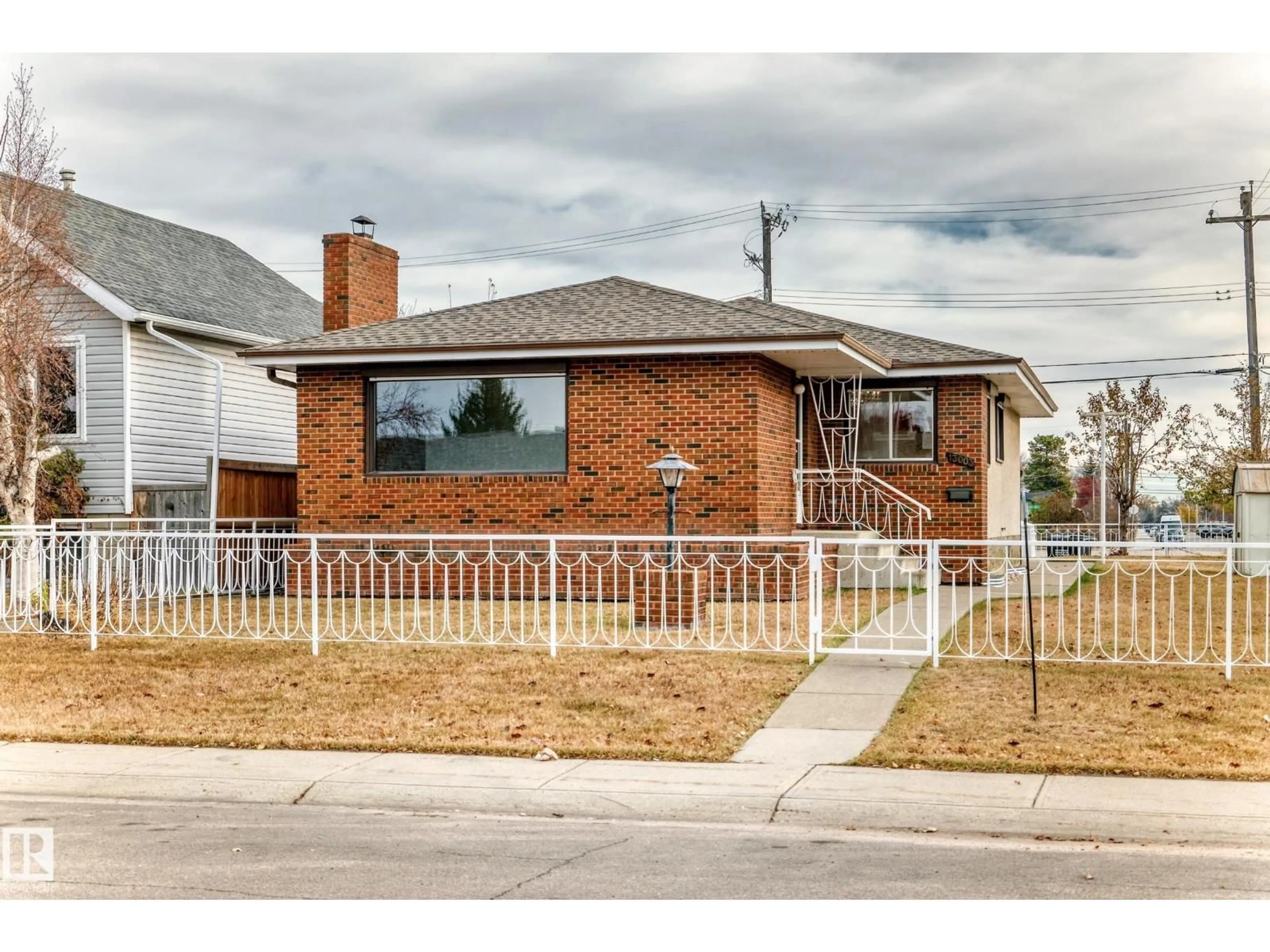 Home with brick exterior material, street for 13003 128 ST, Edmonton Alberta T5L1E6