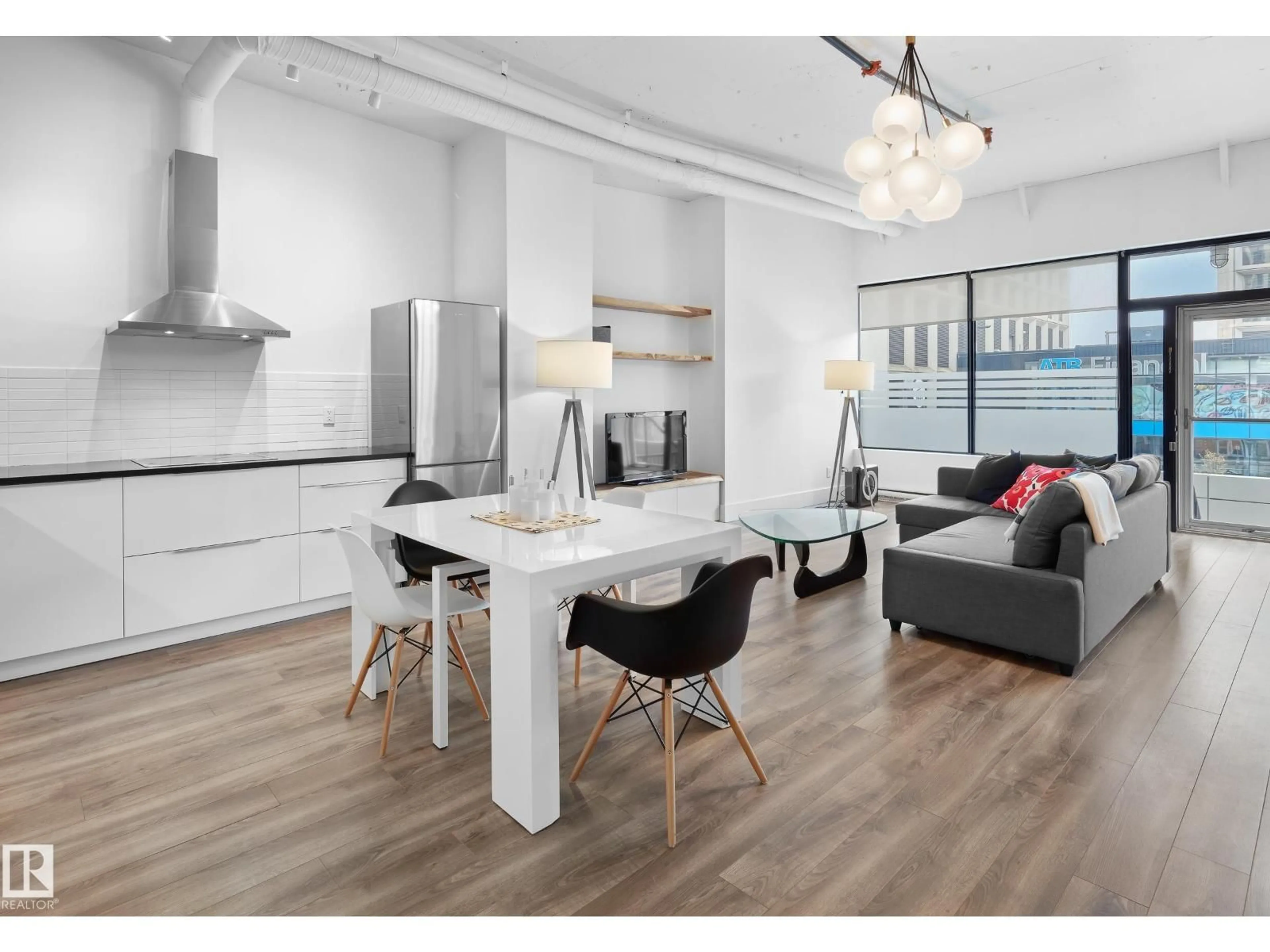 Open concept kitchen, wood/laminate floor for 10024 - 210 JASPER AV, Edmonton Alberta T5J1R9