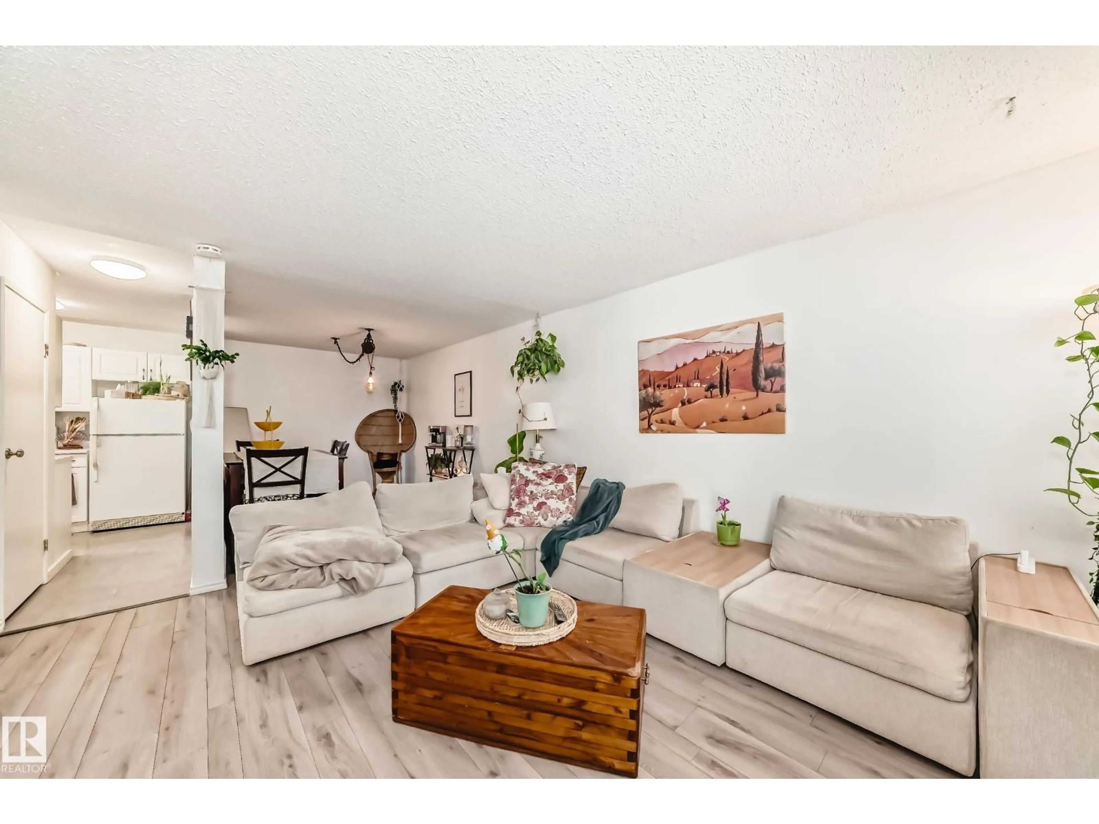 Living room with furniture, wood/laminate floor for 17116 108 ST, Edmonton Alberta T5X3C6