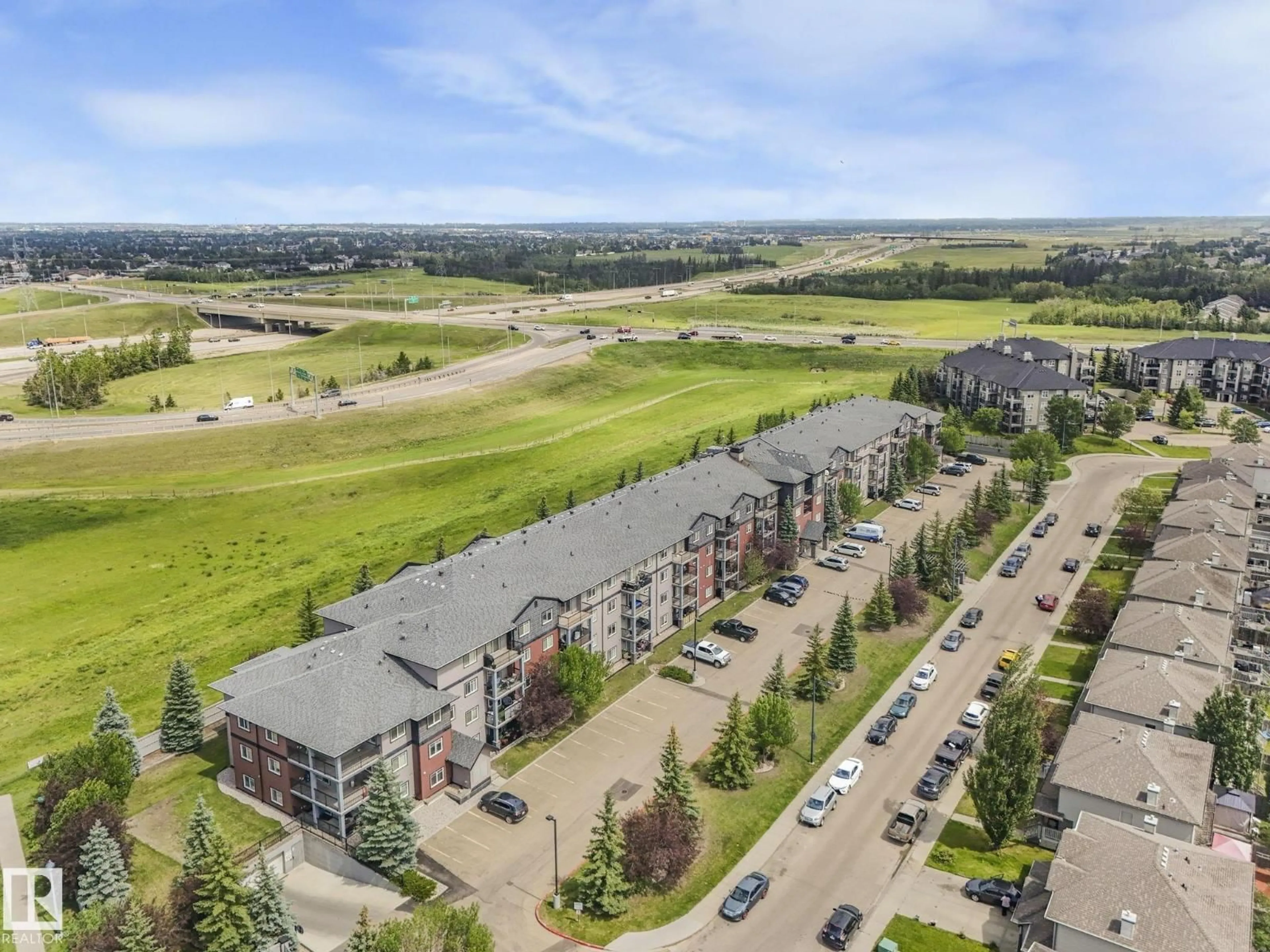 A pic from outside/outdoor area/front of a property/back of a property/a pic from drone, mountain view for #209 - 646 MCALLISTER LO, Edmonton Alberta T6W0B5