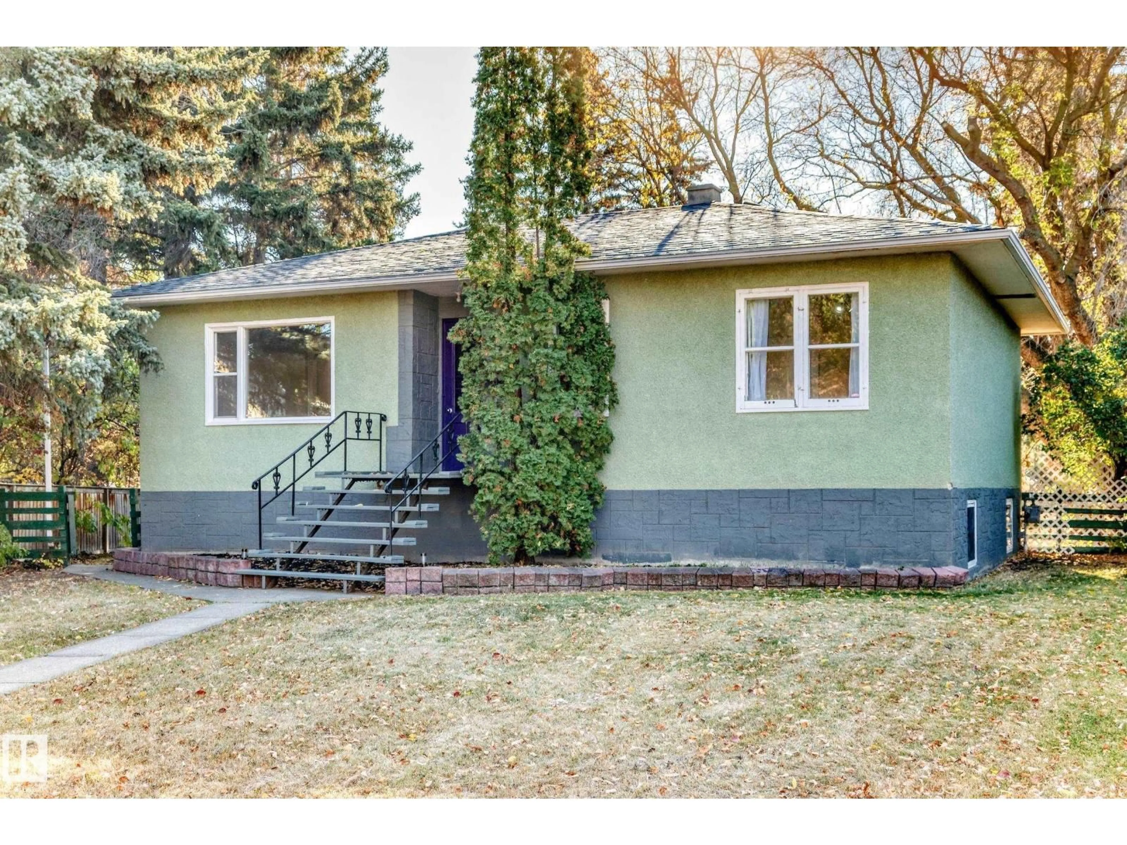 Home with vinyl exterior material, street for 12807 121 AV, Edmonton Alberta T5L2L6