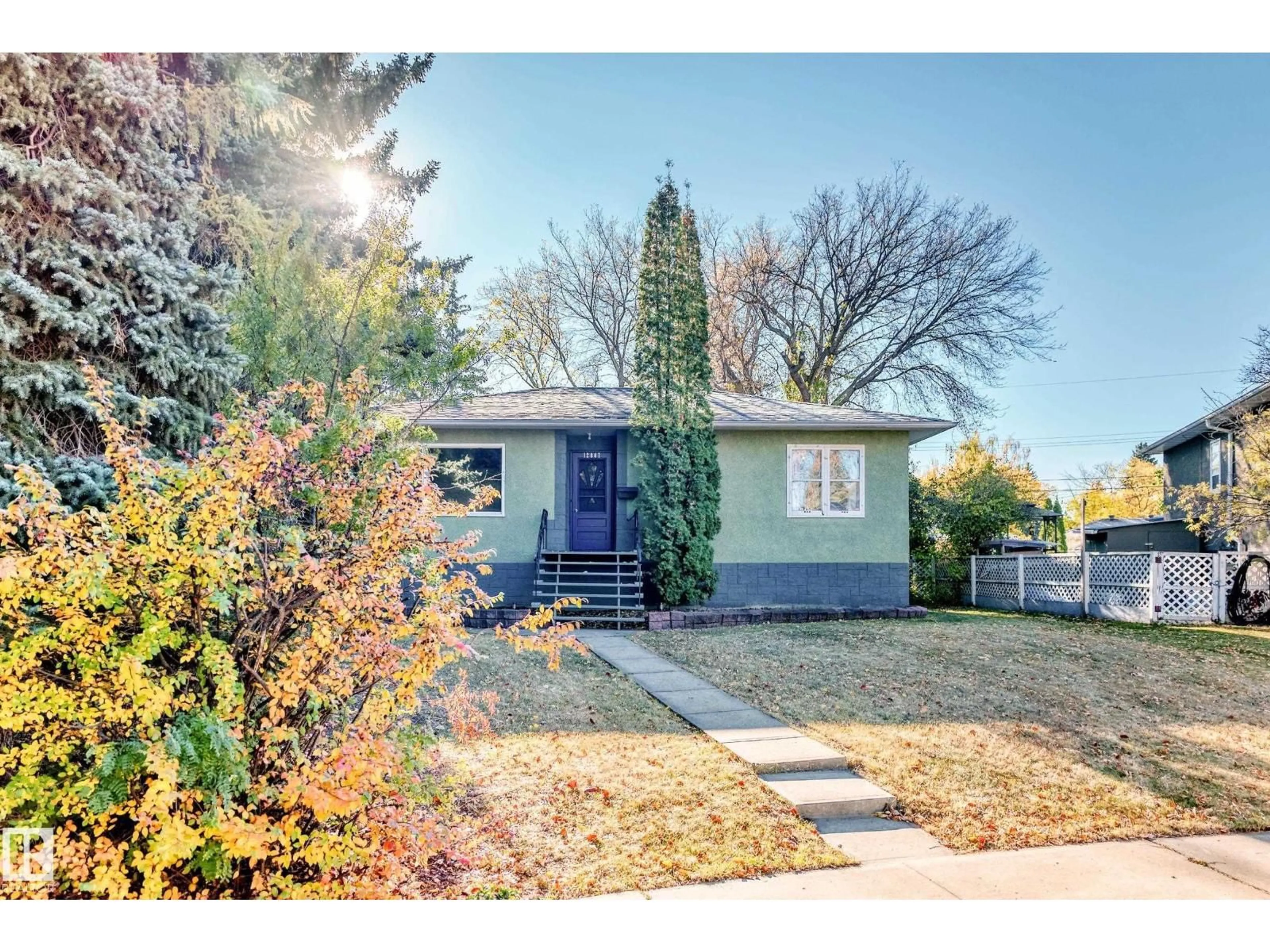 Home with vinyl exterior material, street for 12807 121 AV, Edmonton Alberta T5L2L6