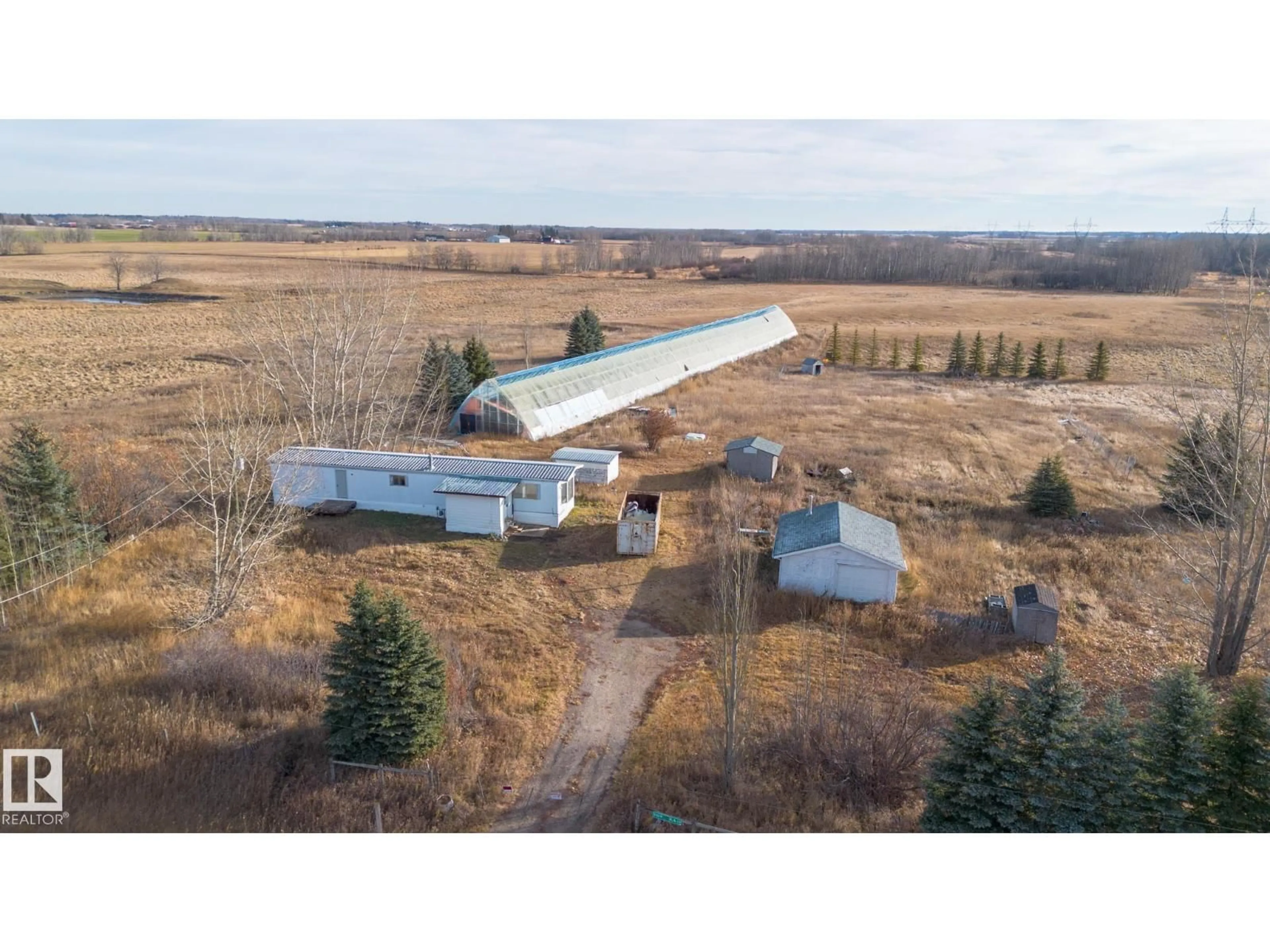 A pic from outside/outdoor area/front of a property/back of a property/a pic from drone, building for 51019 RGE ROAD 10, Rural Parkland County Alberta T7Z1X1