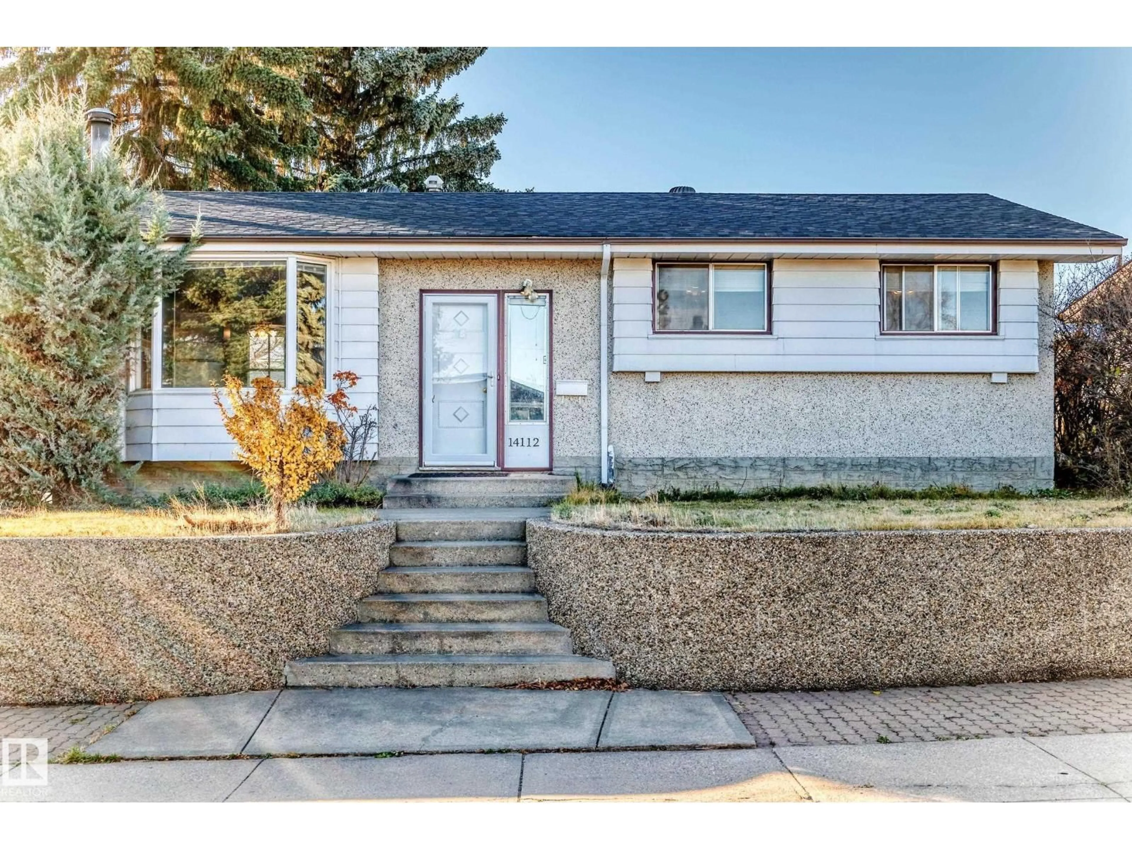 Home with vinyl exterior material, street for 14112 59 ST, Edmonton Alberta T5A1P1