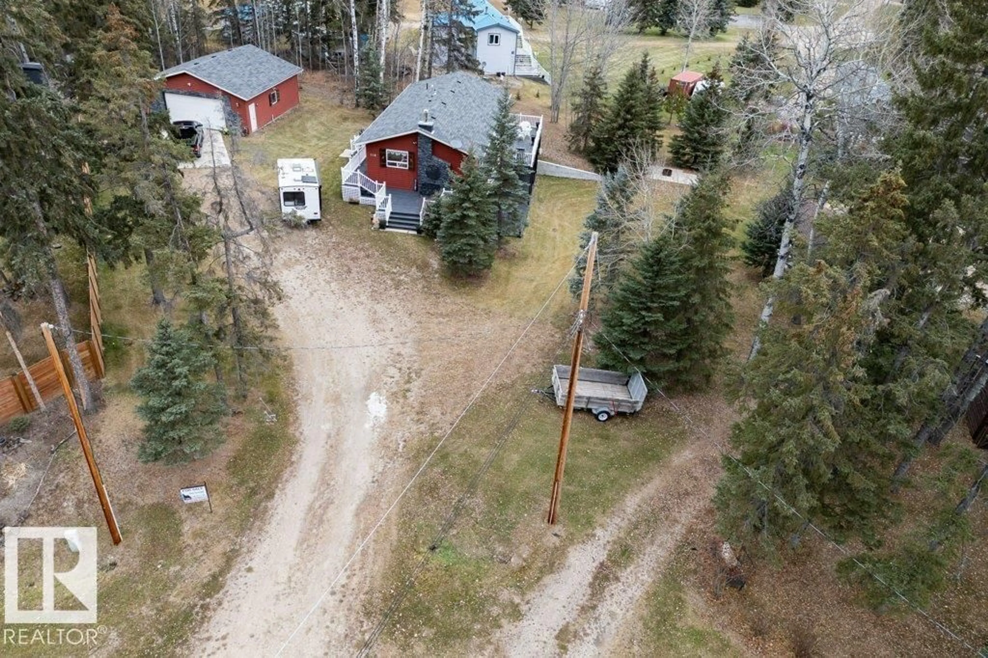 A pic from outside/outdoor area/front of a property/back of a property/a pic from drone, forest/trees view for 118 2 ST, Rural Wetaskiwin County Alberta T0C0A0