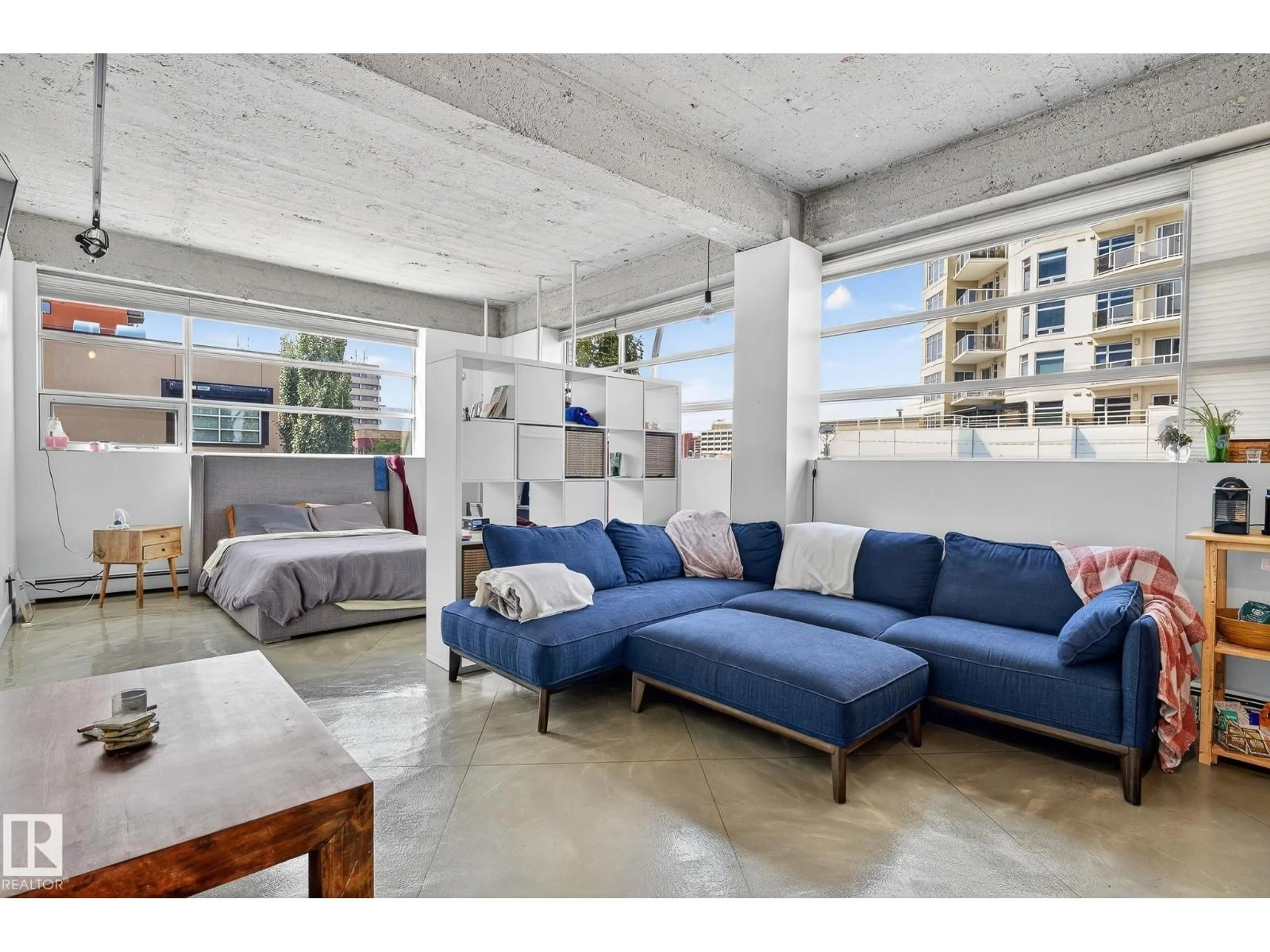 Living room with furniture, cement floor for #201 - 10355 105 ST NW, Edmonton Alberta T5J1E8