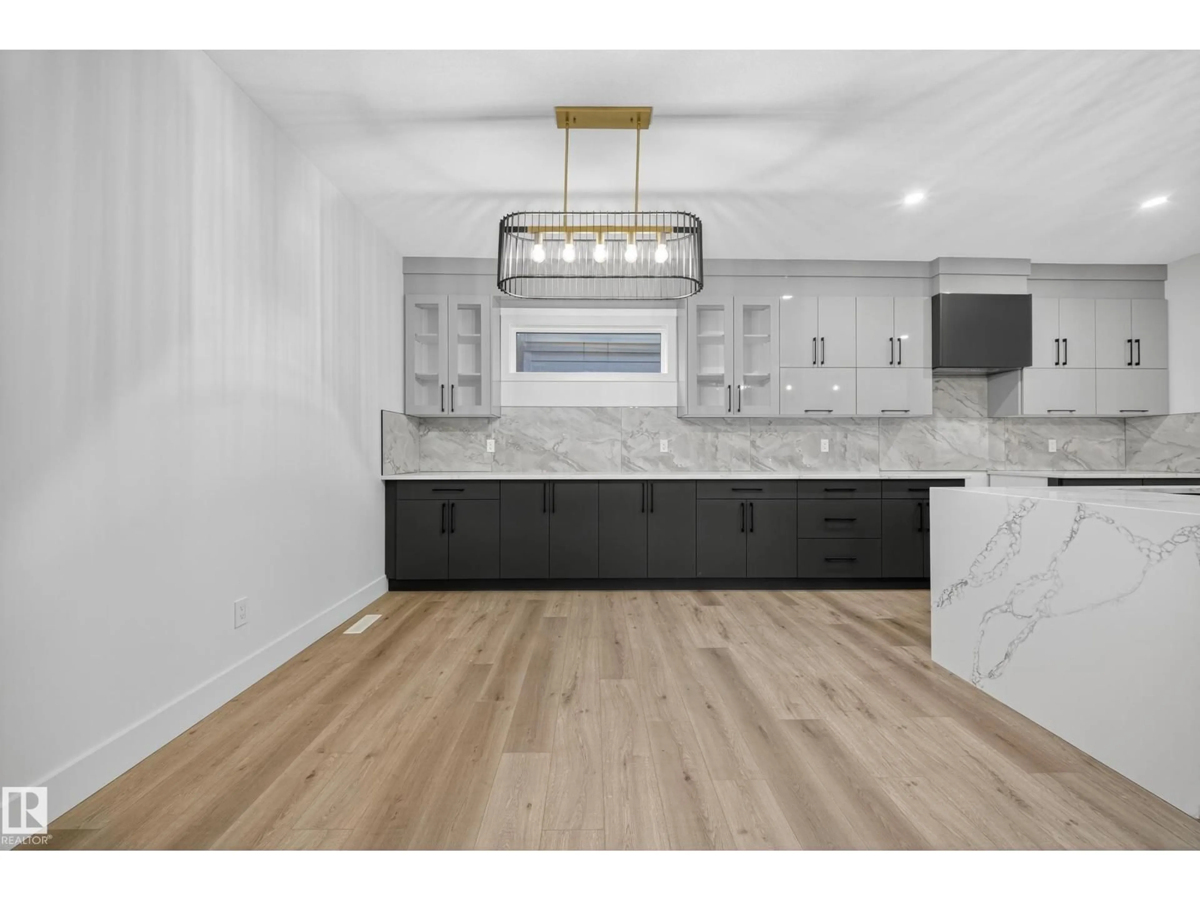 Open concept kitchen, wood/laminate floor for 6117 CRAWFORD DR, Edmonton Alberta T6W4L7