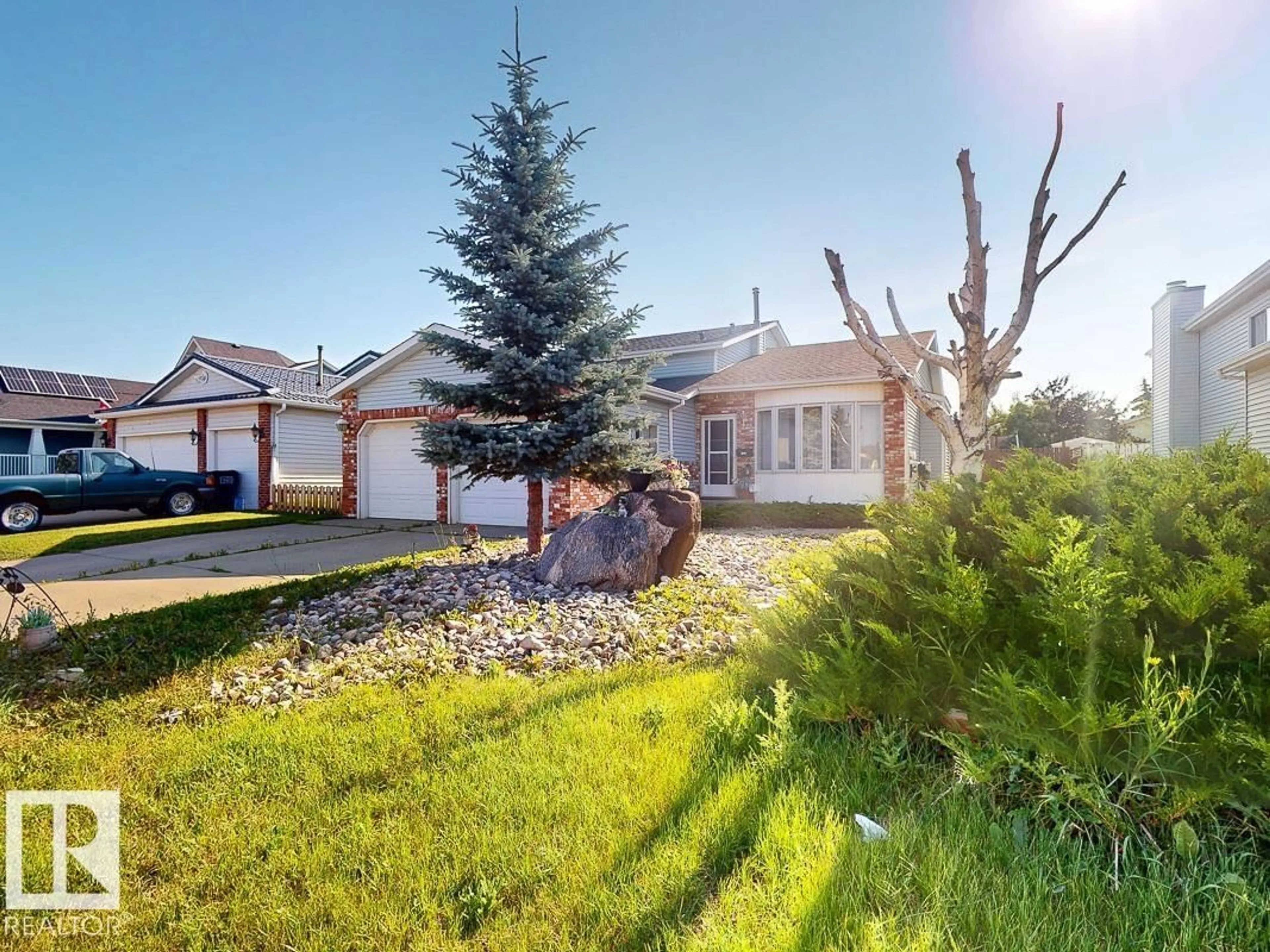 Home with vinyl exterior material, street for NW - 9803 185 ST, Edmonton Alberta T5T3L7