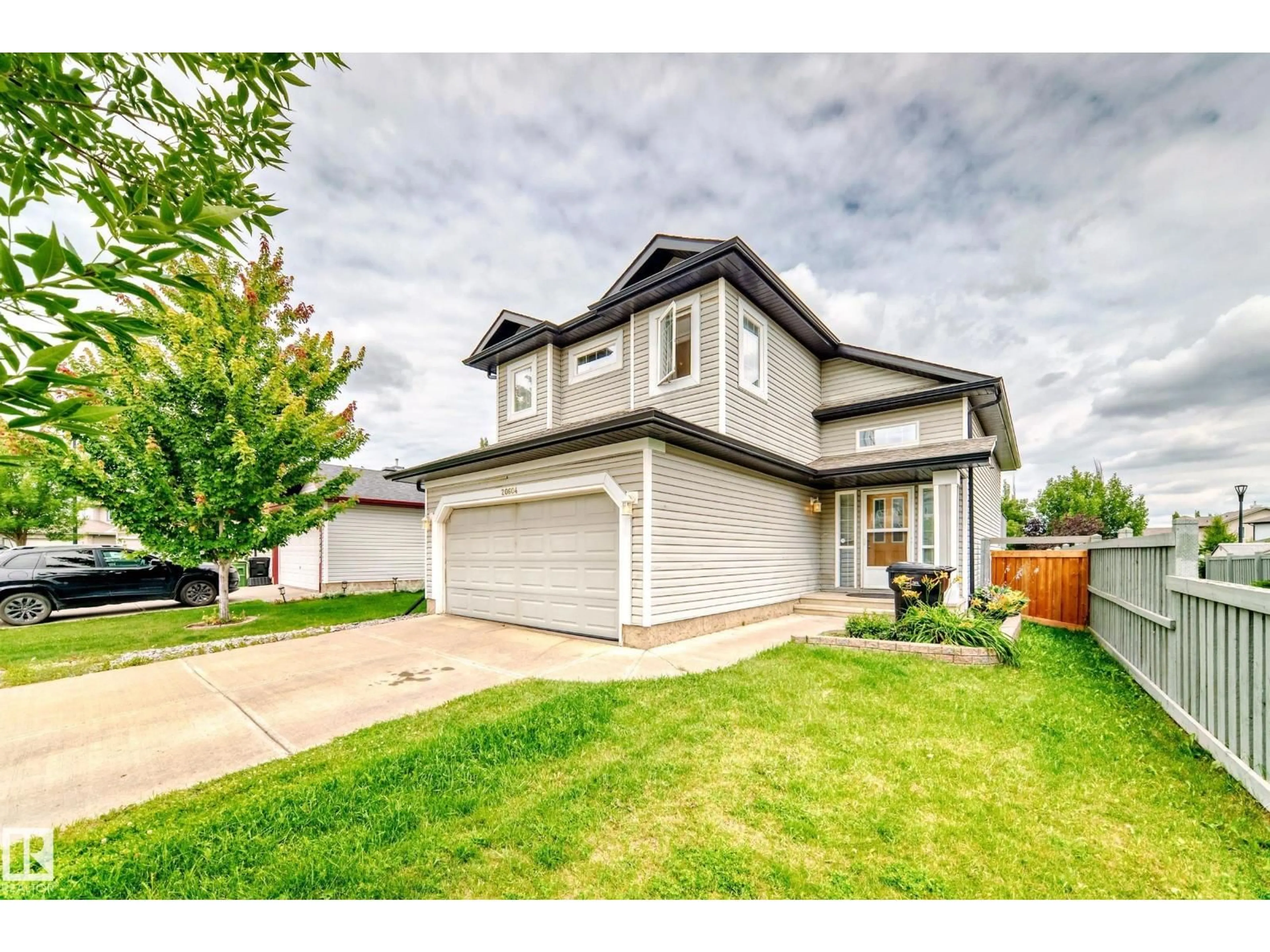 Home with vinyl exterior material, street for NW - 20604 48 AV, Edmonton Alberta T6M0C1
