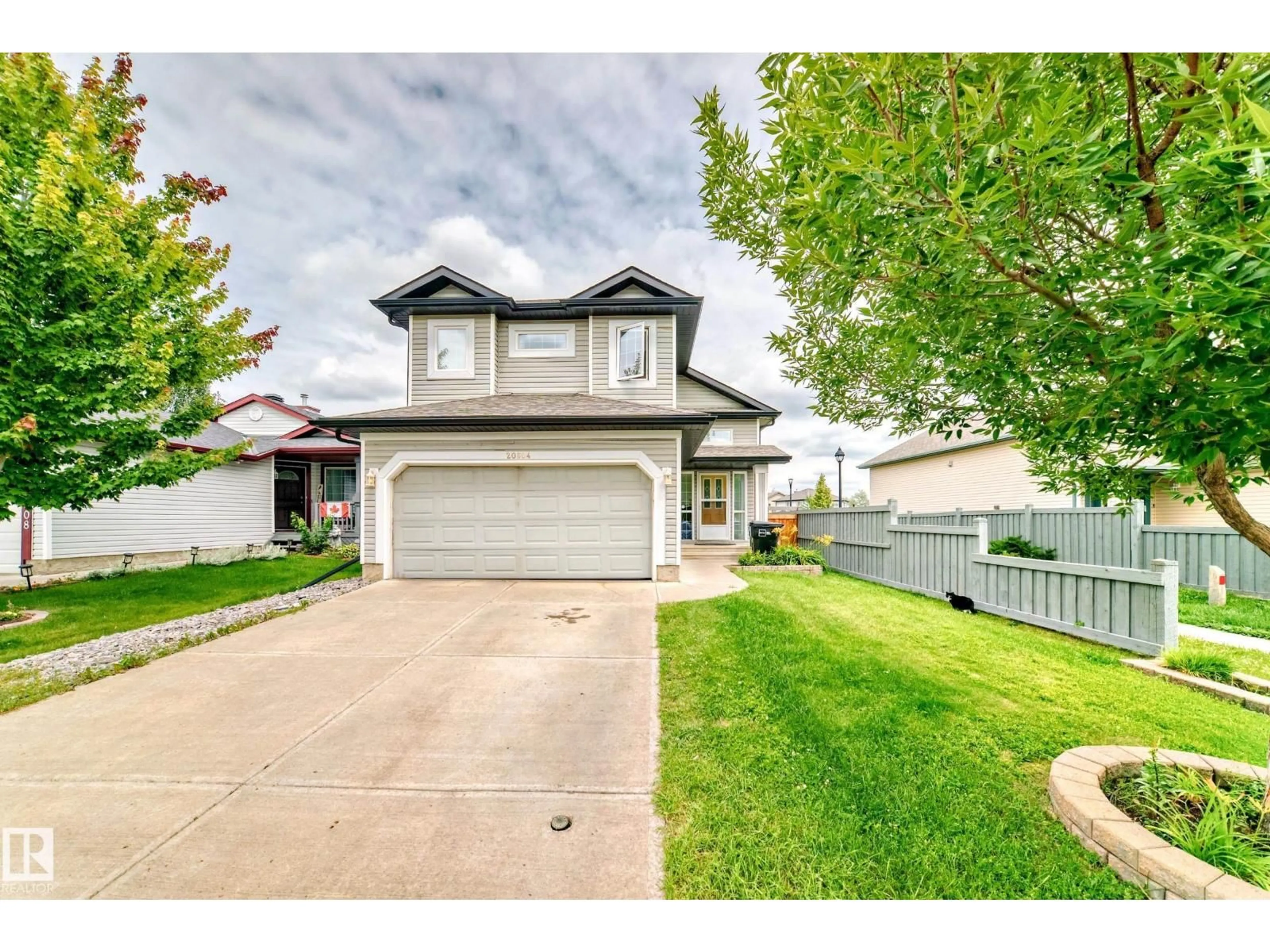 Home with vinyl exterior material, street for NW - 20604 48 AV, Edmonton Alberta T6M0C1