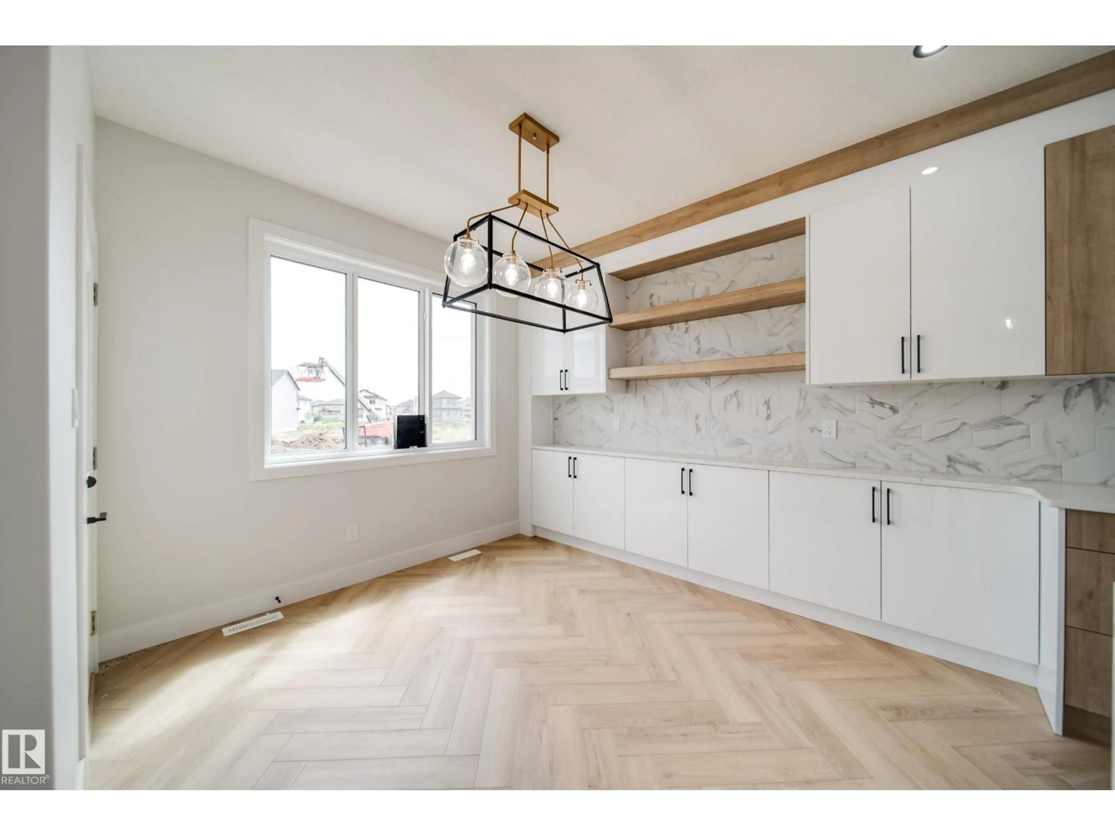 Open concept kitchen, wood/laminate floor for 8815 183 AV, Edmonton Alberta T5Z0S8