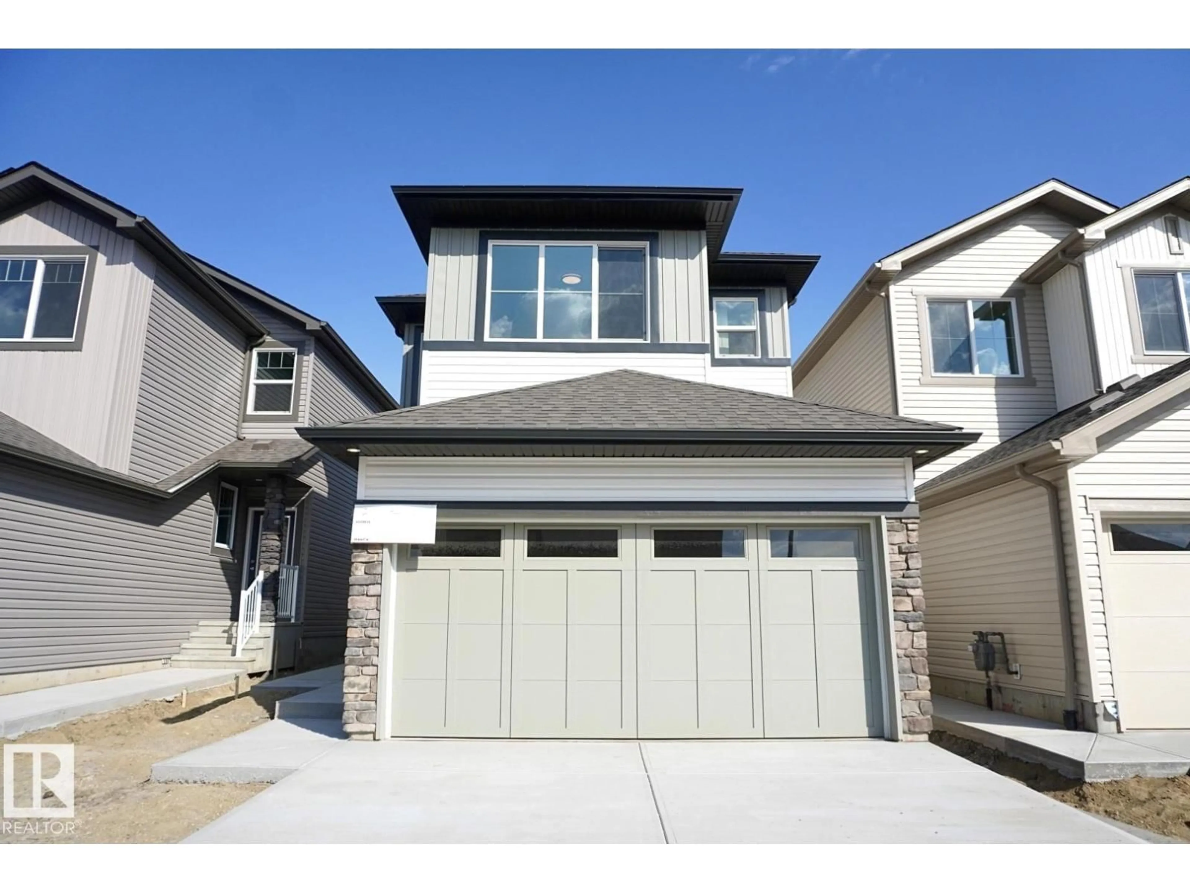Home with vinyl exterior material, street for NW - 2013 209A ST, Edmonton Alberta T6M3C8