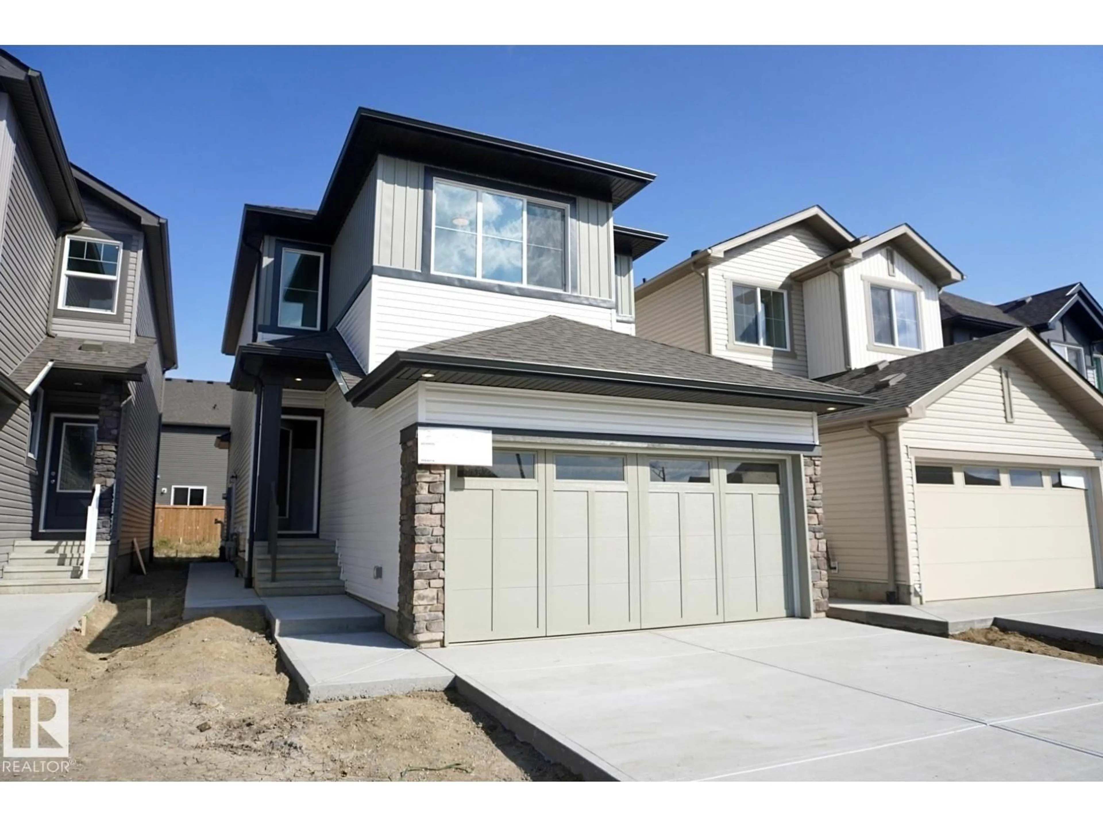 Home with vinyl exterior material, street for NW - 2013 209A ST, Edmonton Alberta T6M3C8