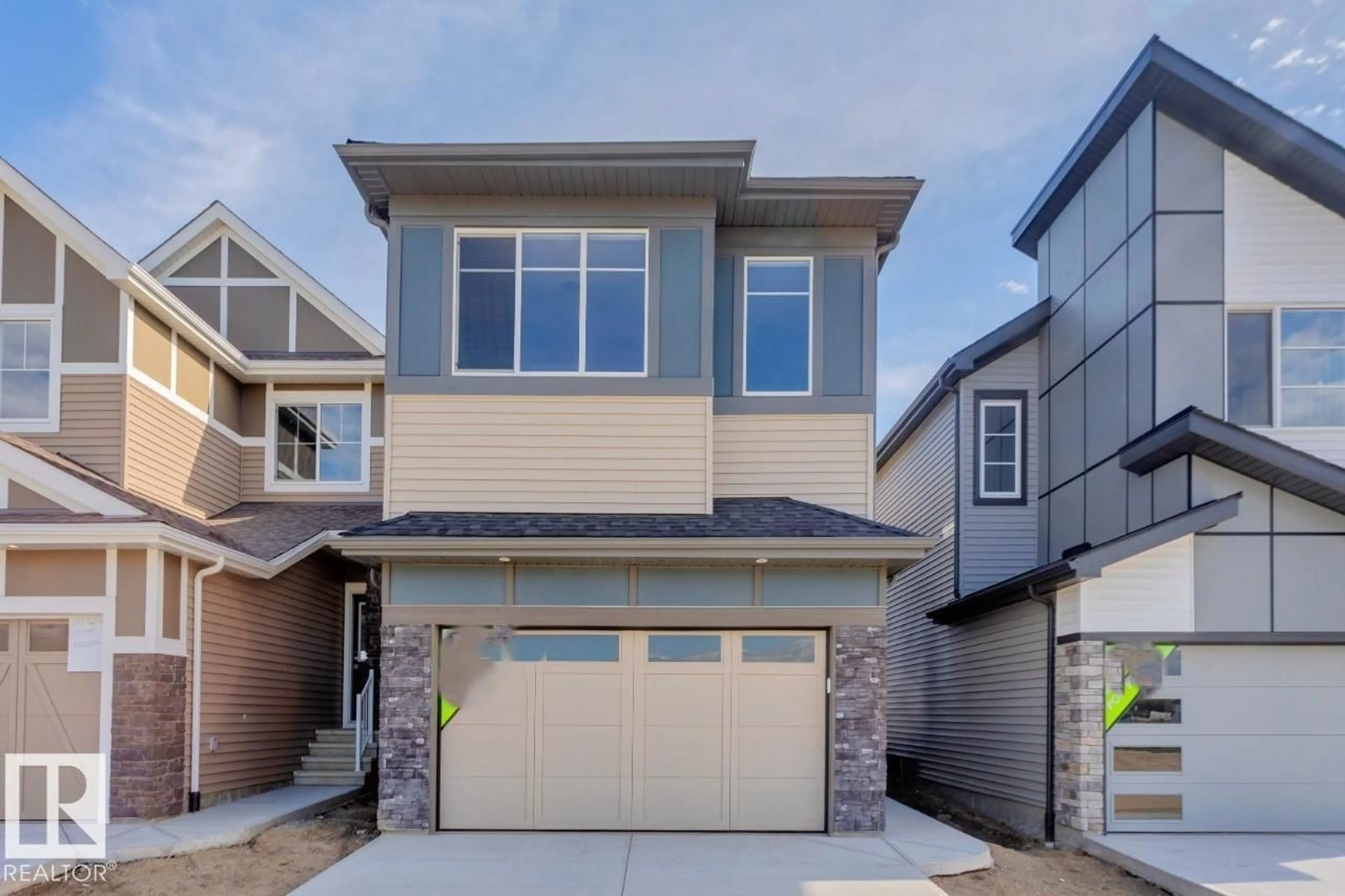 Home with vinyl exterior material, street for 2369 EGRET WY, Edmonton Alberta T6M3G9