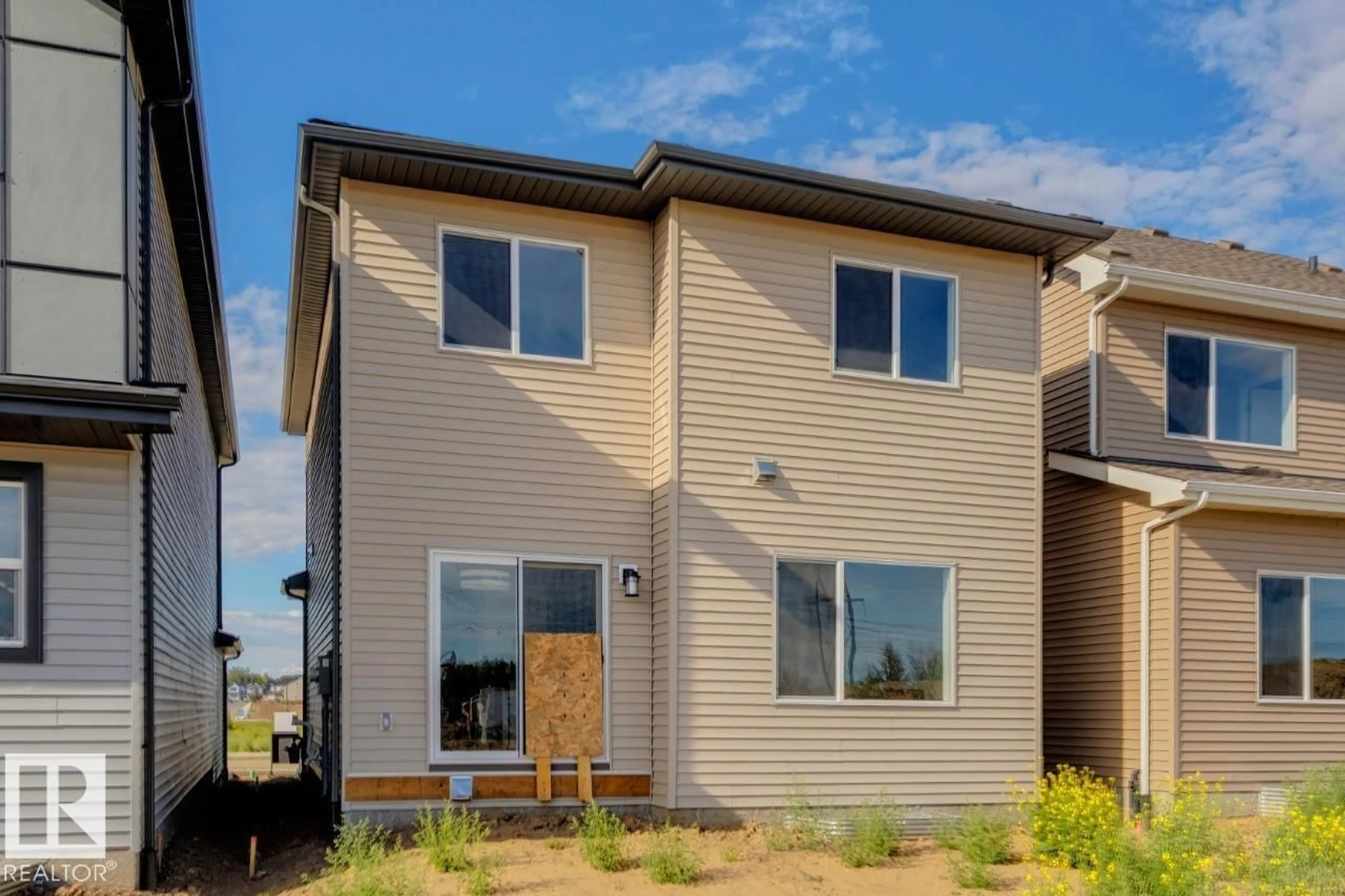 Home with vinyl exterior material, street for 2369 EGRET WY, Edmonton Alberta T6M3G9