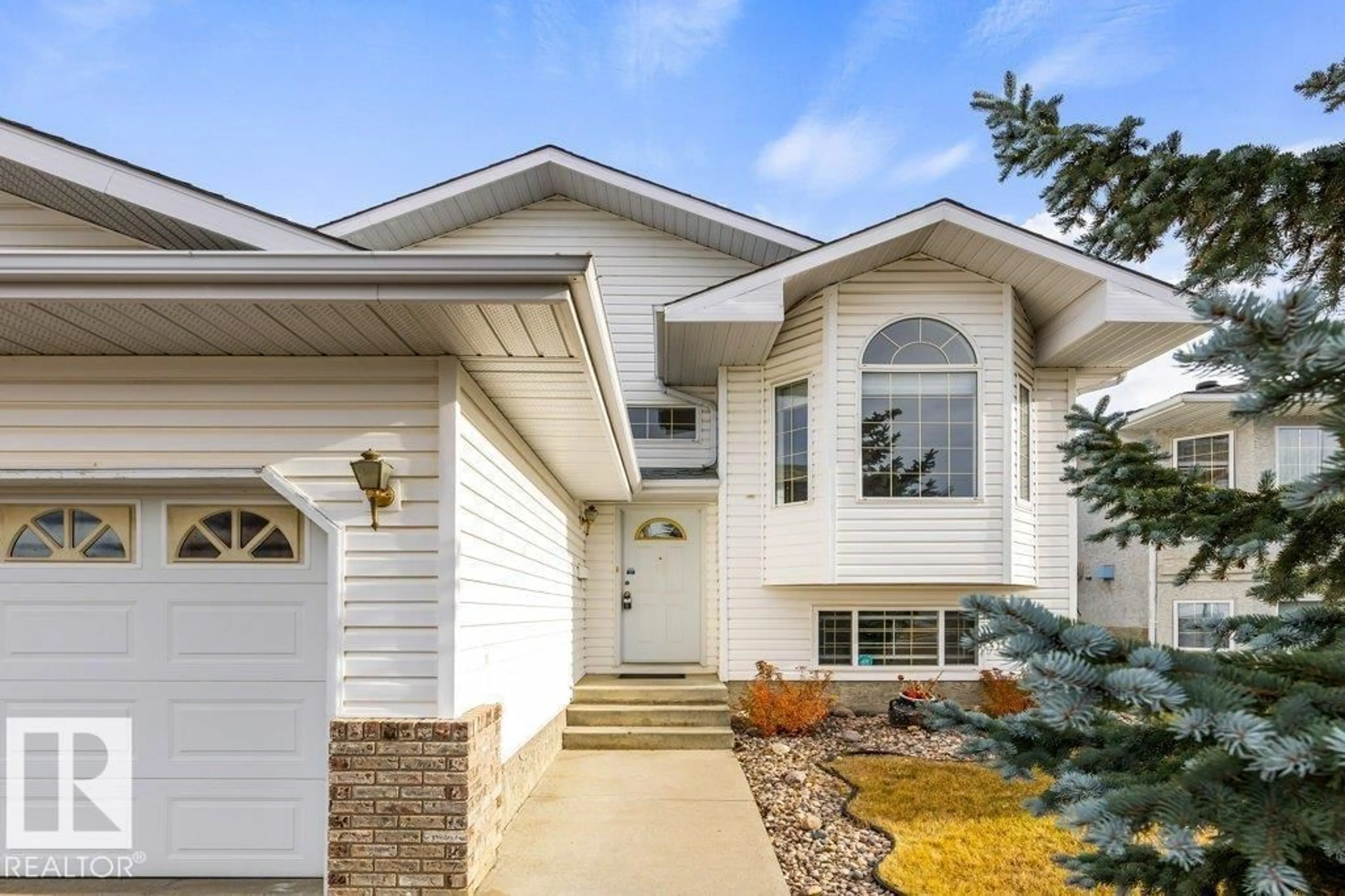 Home with vinyl exterior material, street for 949 JORDAN CR, Edmonton Alberta T6L7A5