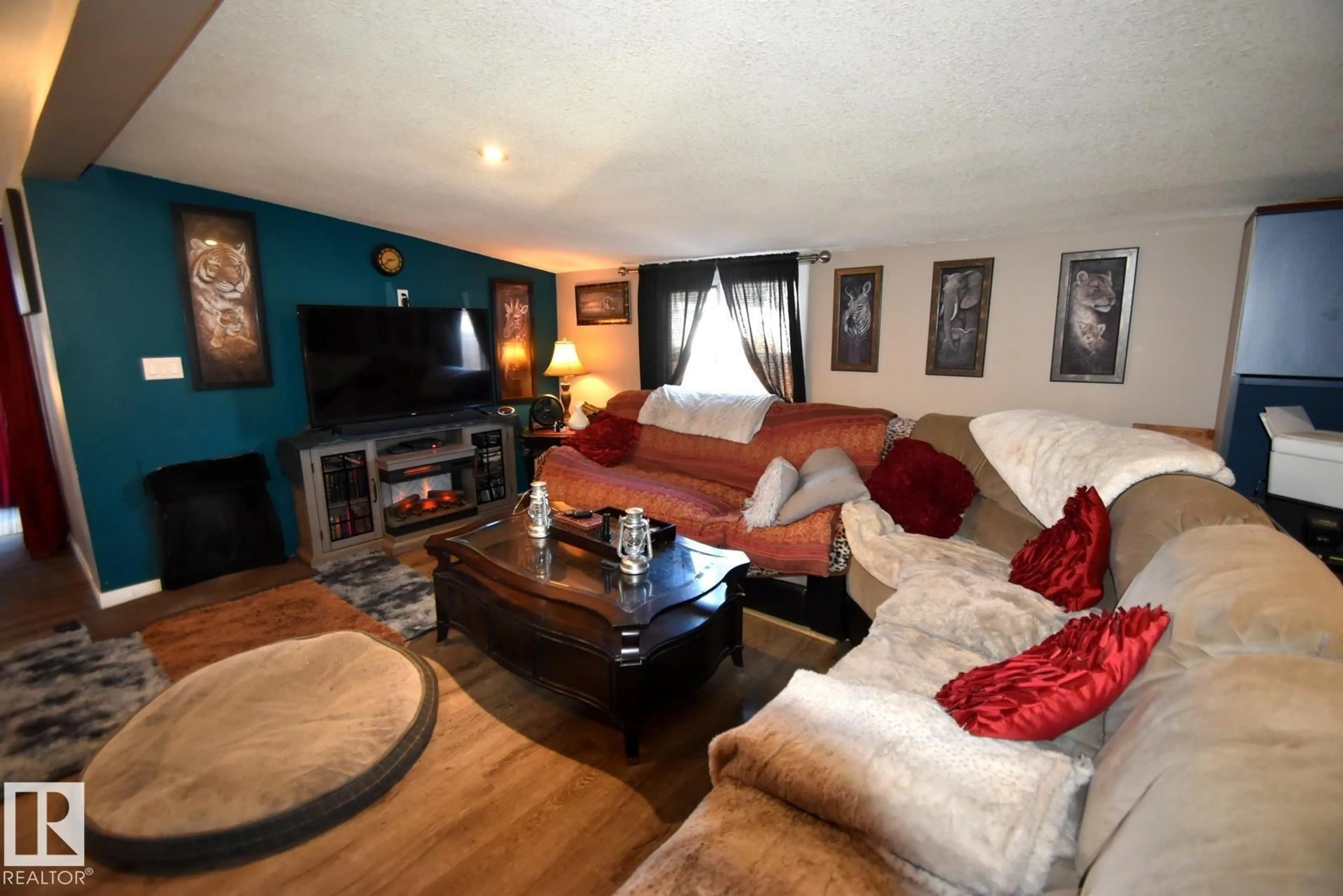 Living room with furniture, wood/laminate floor for 1259 LAKE VISTA CR, Sherwood Park Alberta T8H1K7
