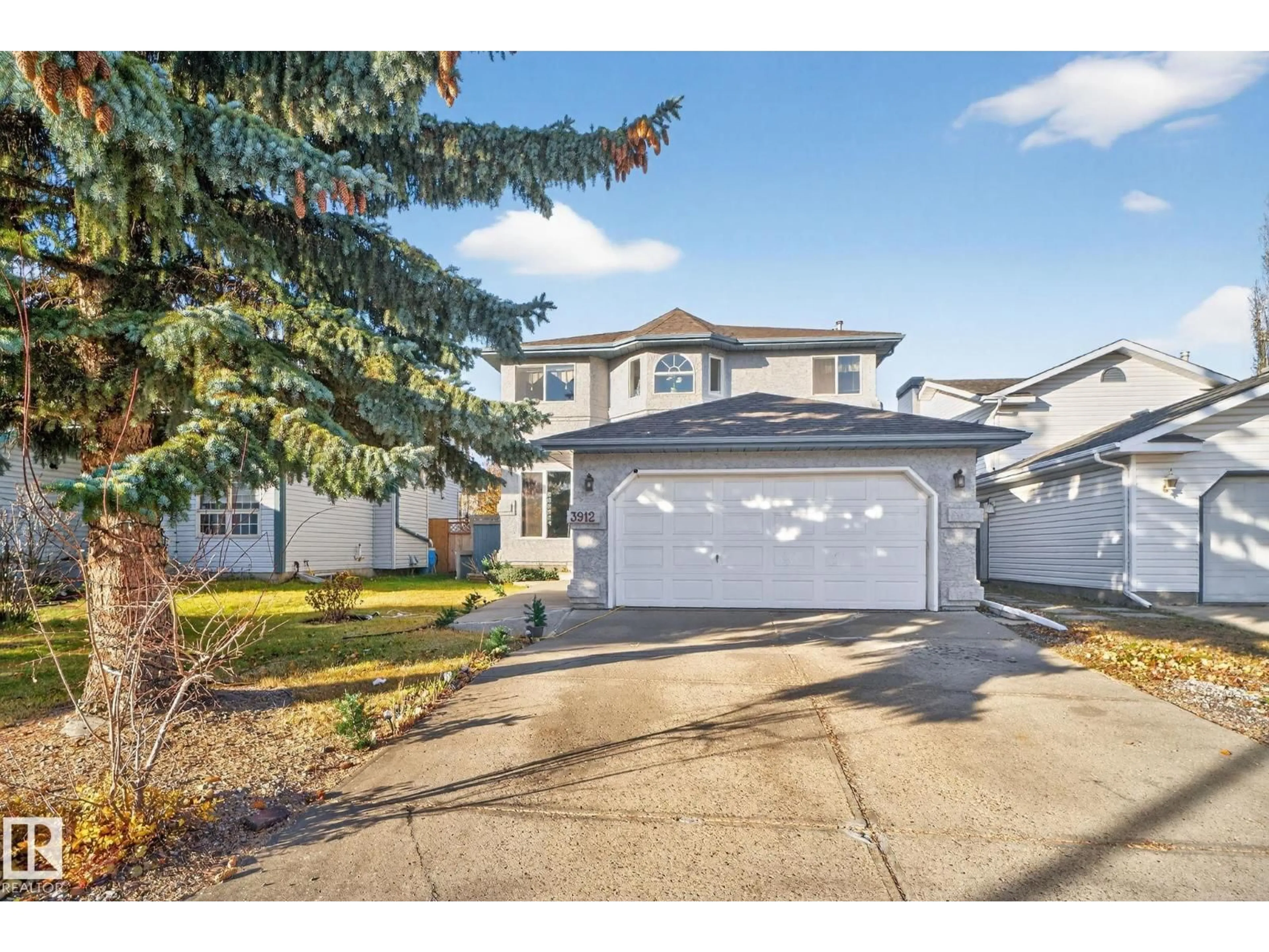 Home with vinyl exterior material, street for 3912 31 ST, Edmonton Alberta T6T1J5