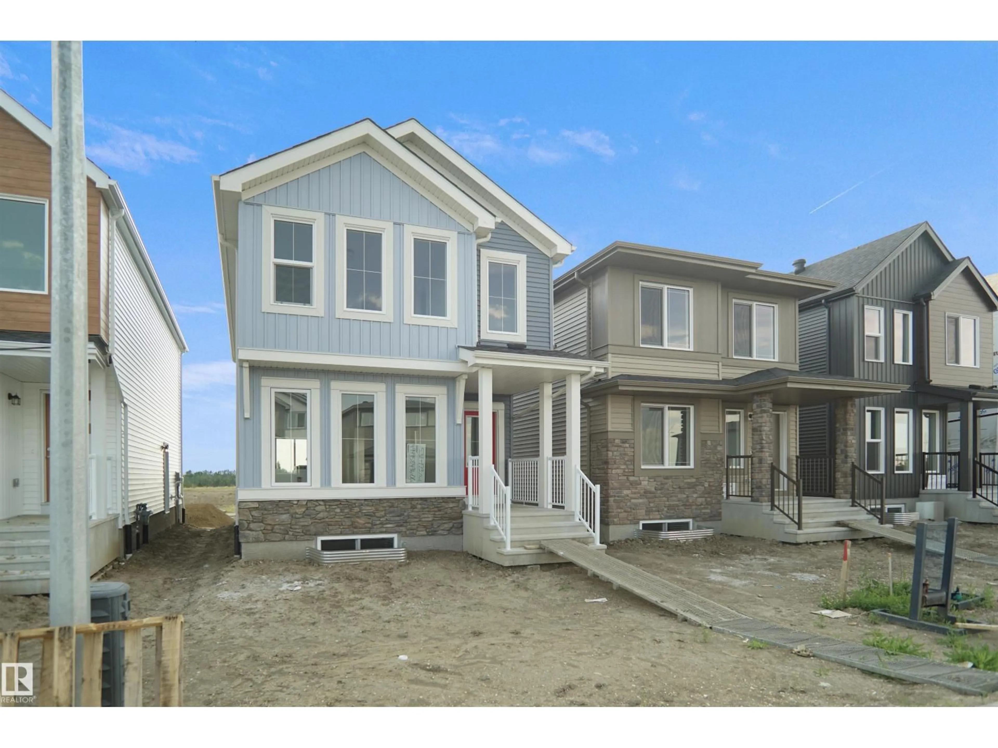 Home with vinyl exterior material, street for NW - 7415 181 AV, Edmonton Alberta T5Z0T4