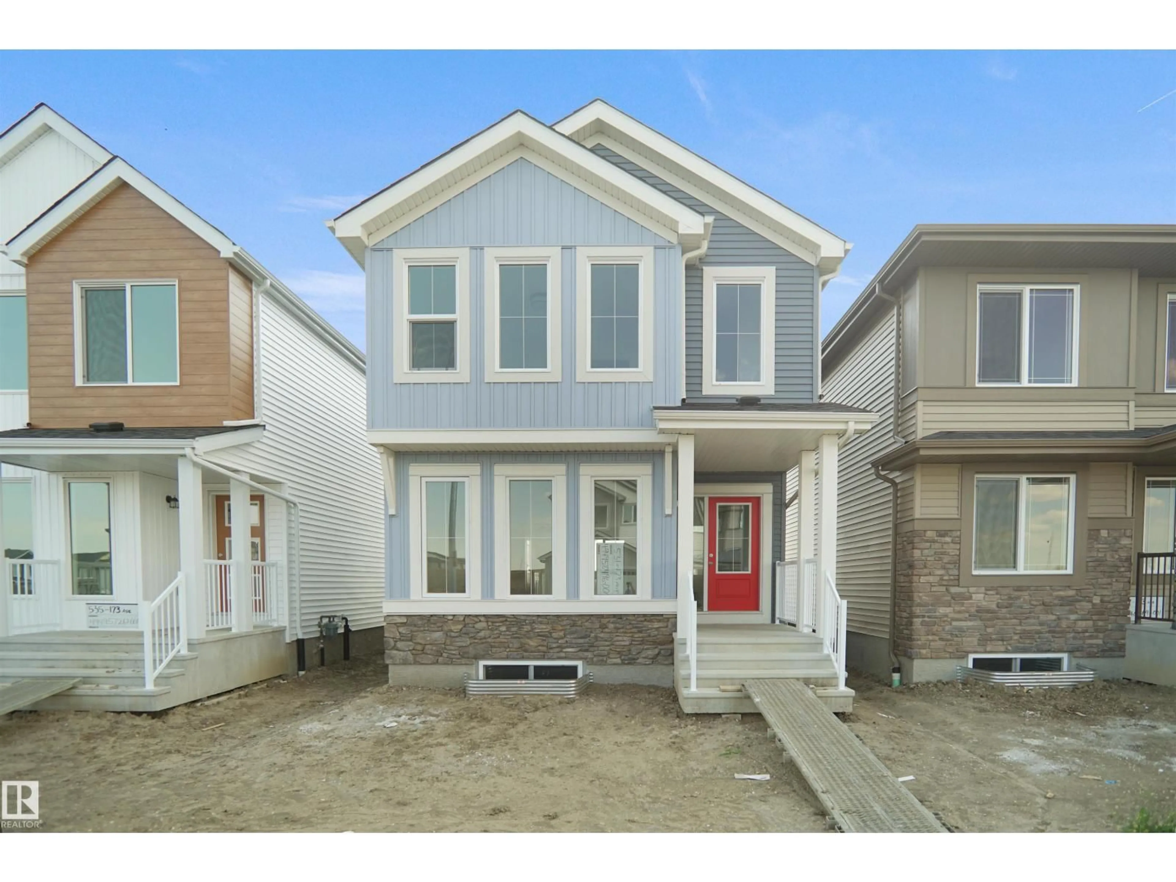 Home with vinyl exterior material, street for NW - 7415 181 AV, Edmonton Alberta T5Z0T4