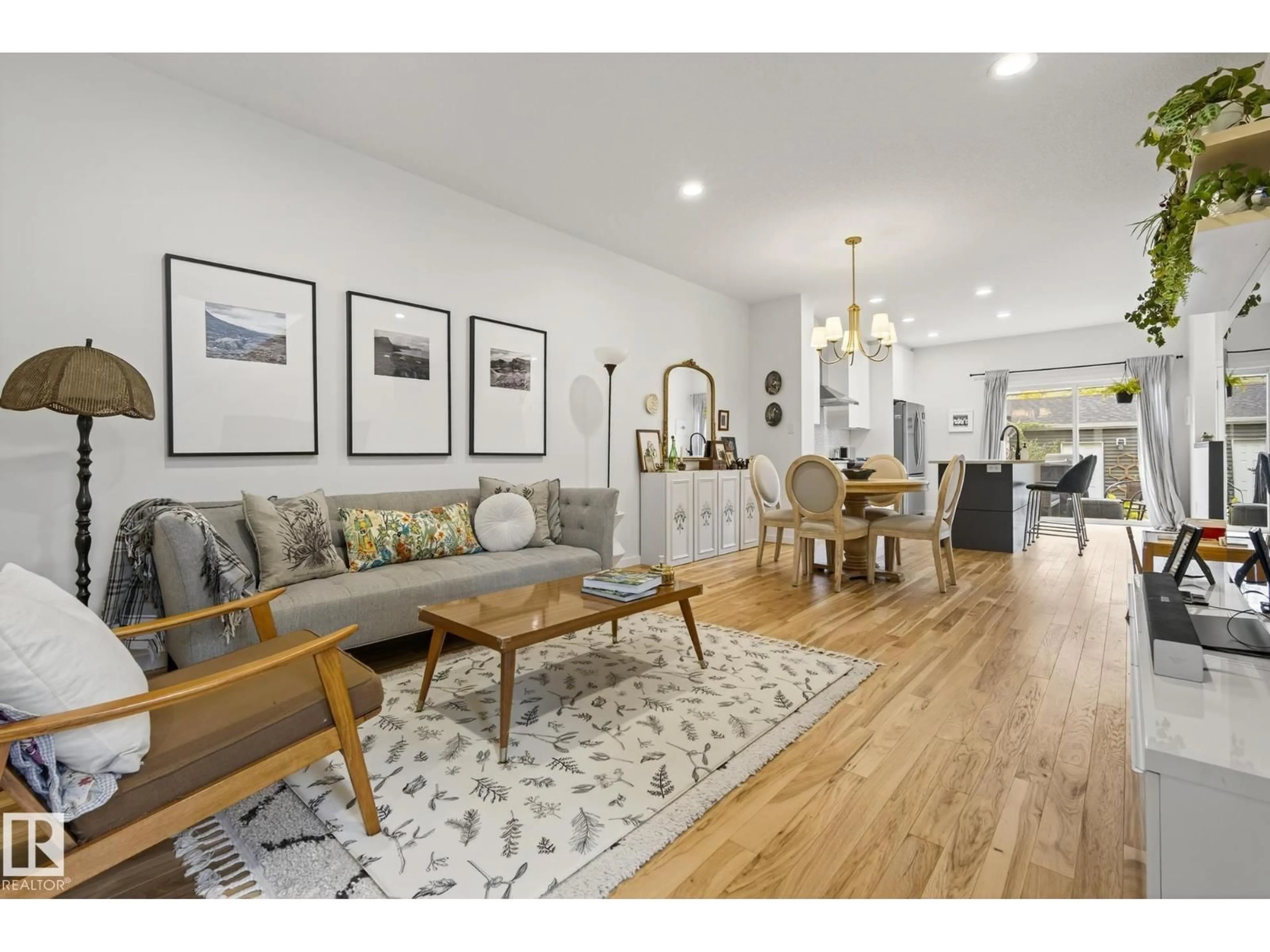 Living room with furniture, wood/laminate floor for NW - 11219 132 ST, Edmonton Alberta T5M1E7