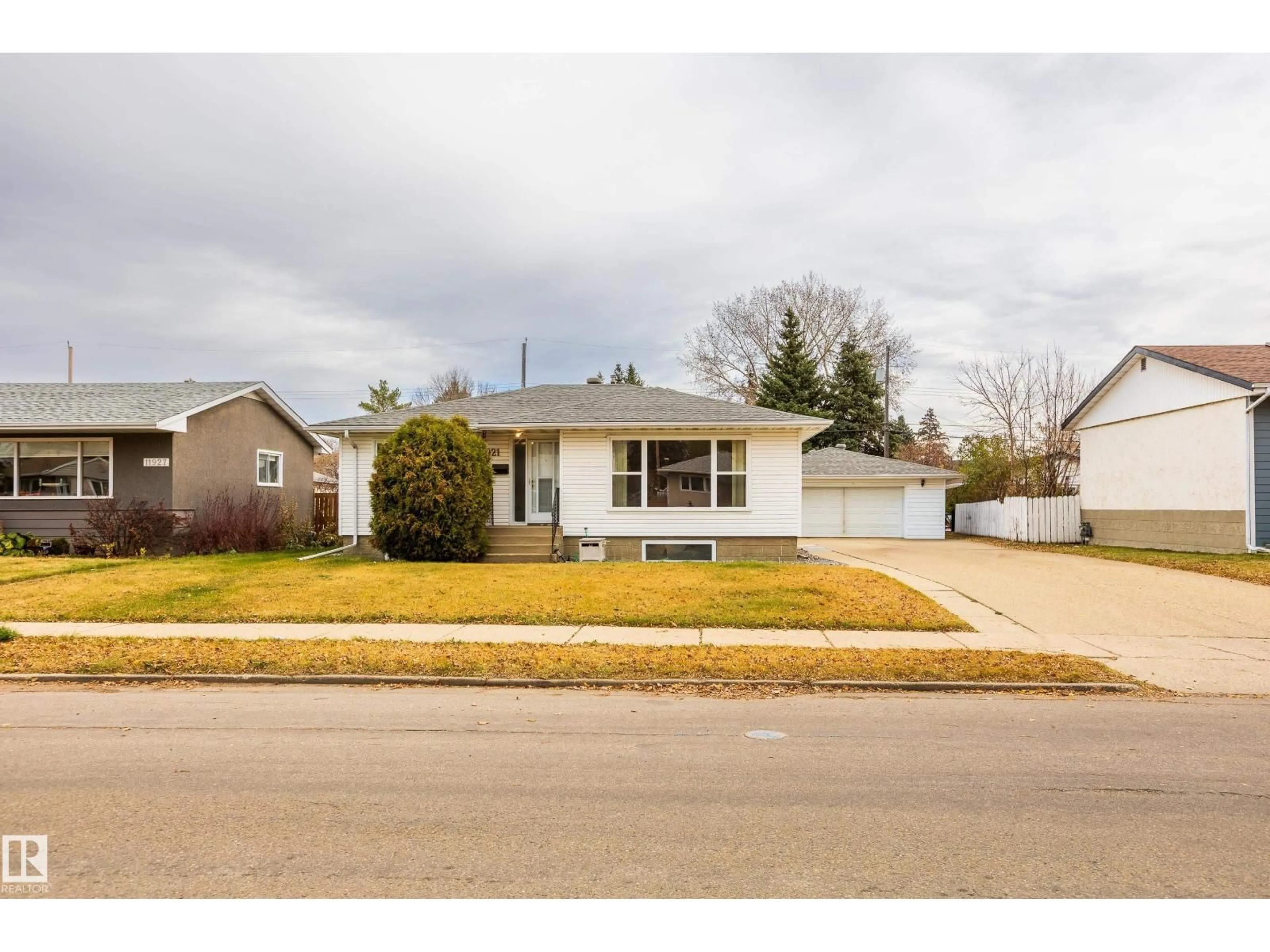 Home with vinyl exterior material, street for NW - 11921 36 ST, Edmonton Alberta T5W2B3