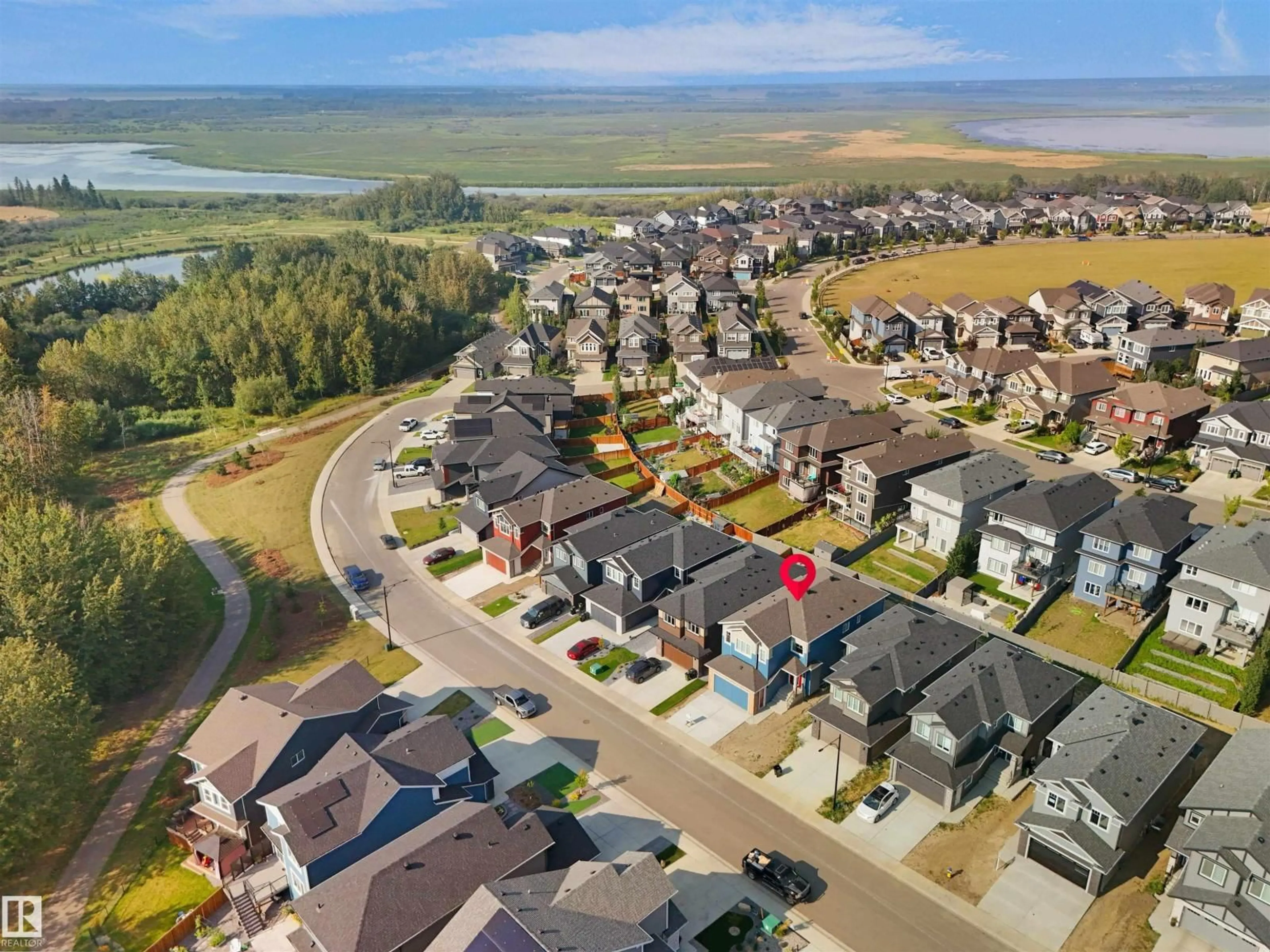 A pic from outside/outdoor area/front of a property/back of a property/a pic from drone, water/lake/river/ocean view for 1160 GYRFALCON CR, Edmonton Alberta T5S0S1