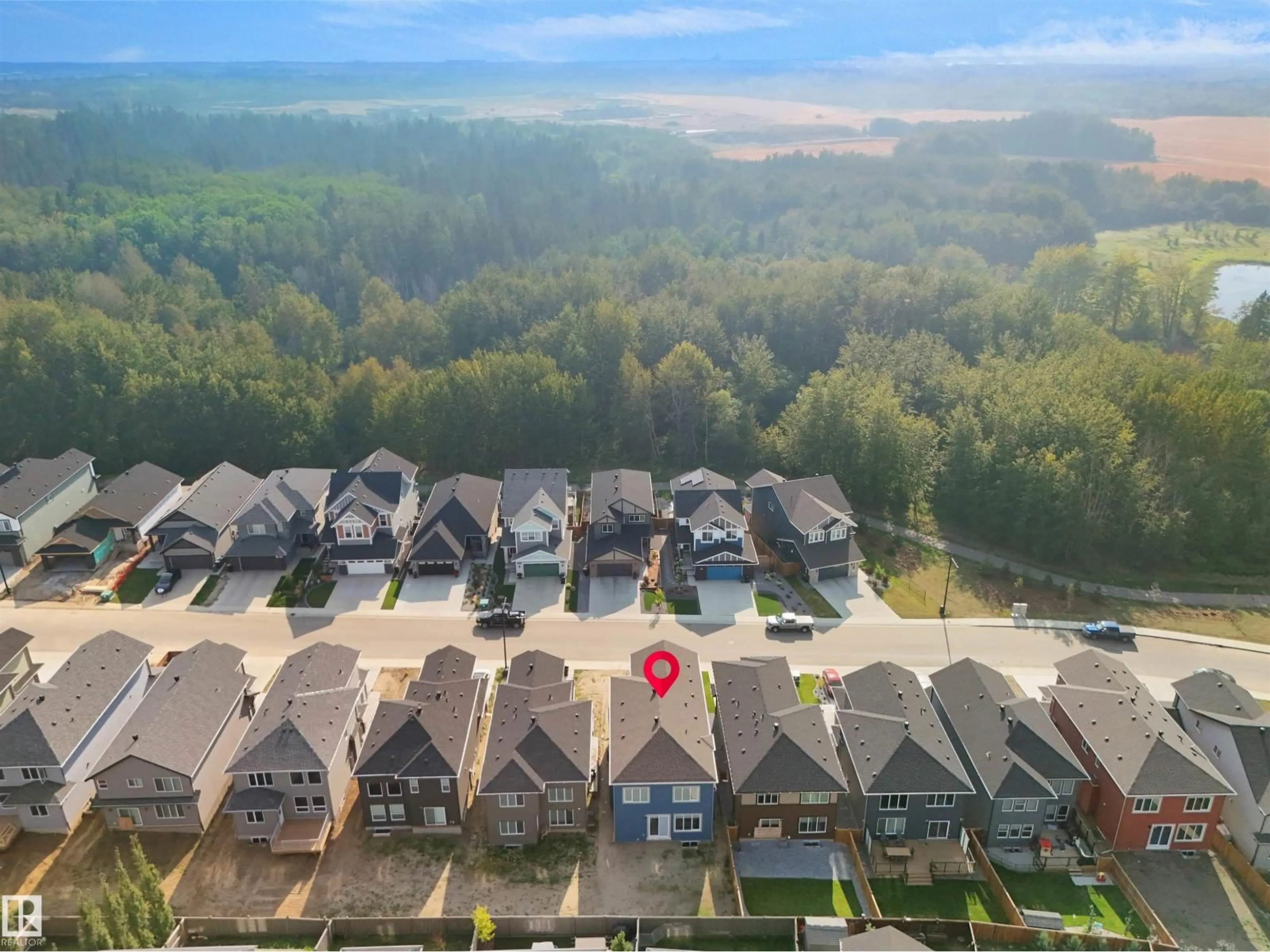 A pic from outside/outdoor area/front of a property/back of a property/a pic from drone, unknown for 1160 GYRFALCON CR, Edmonton Alberta T5S0S1