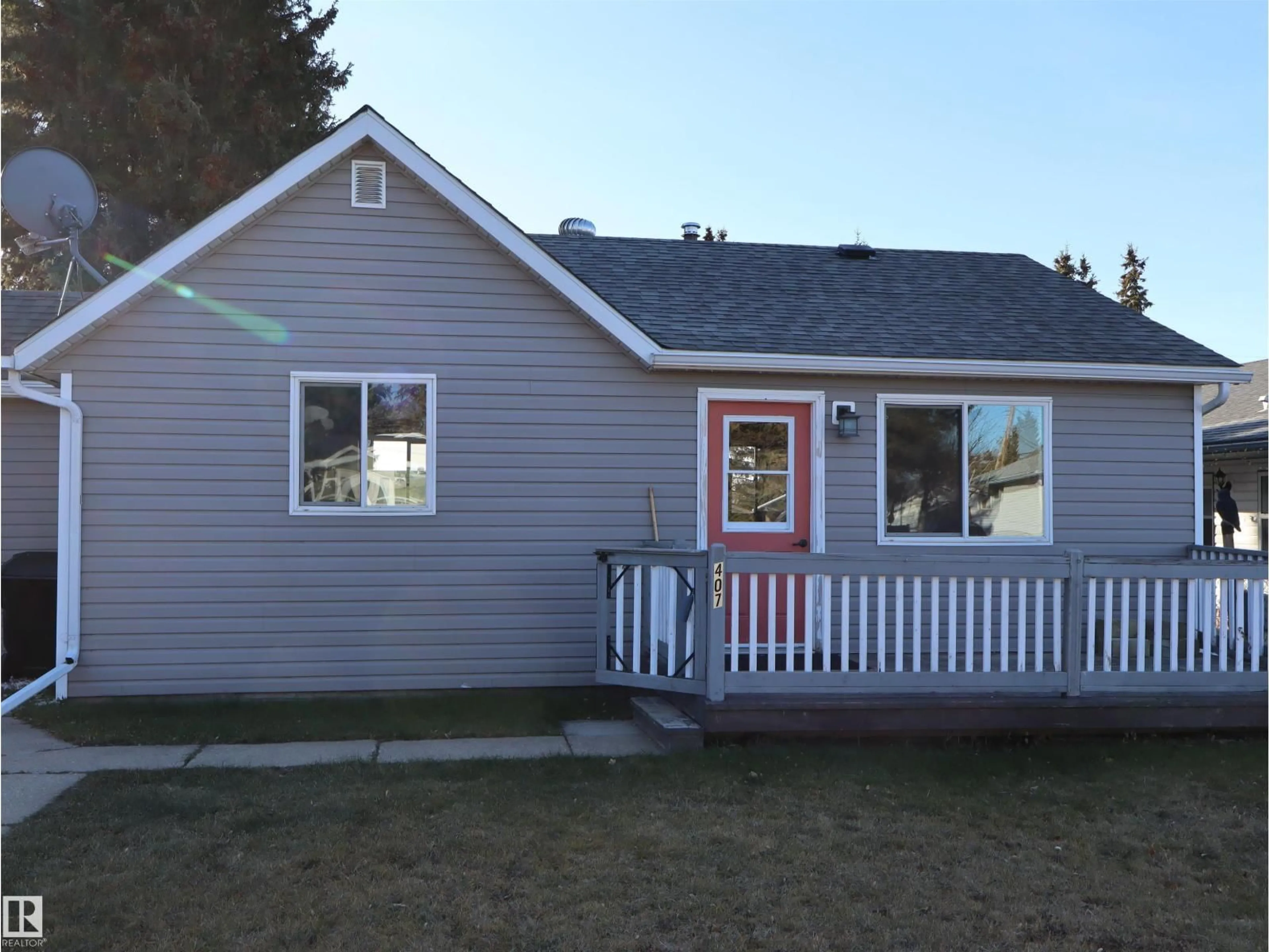 Home with vinyl exterior material, street for 4407 54 AV, Barrhead Alberta T7N1J8