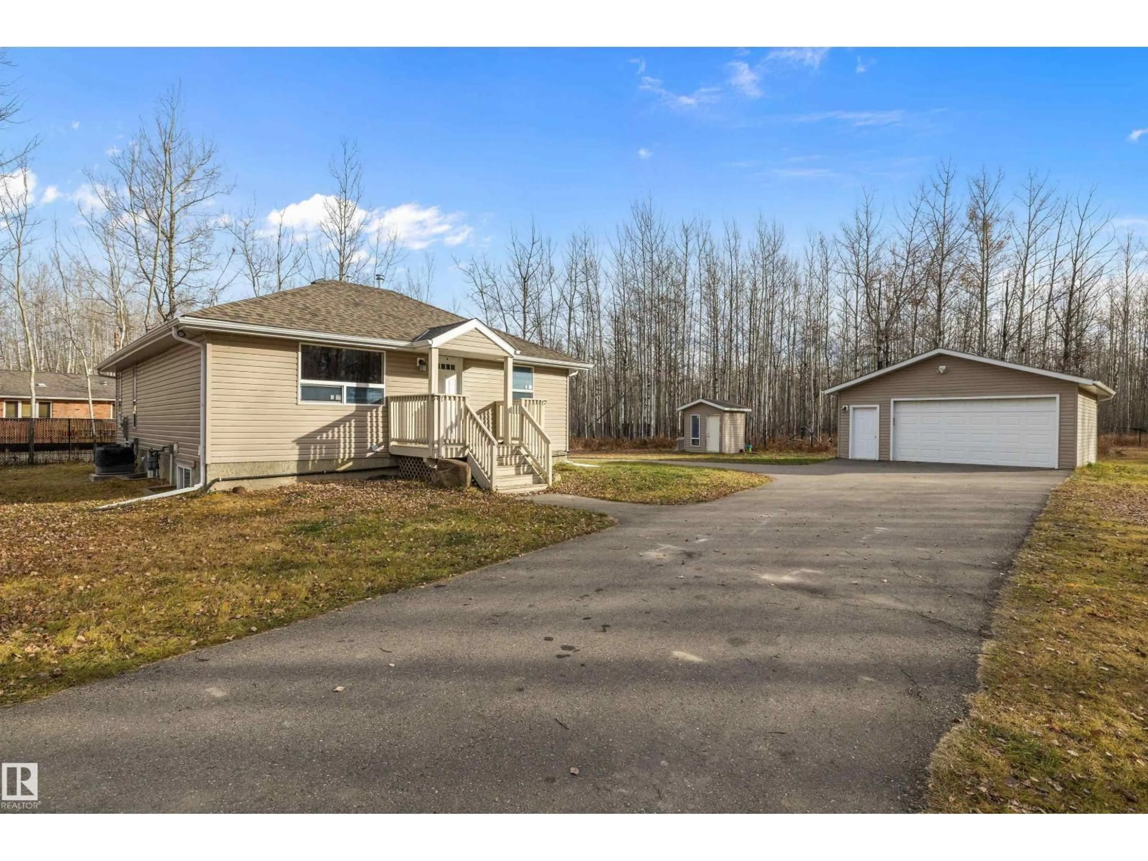 A pic from outside/outdoor area/front of a property/back of a property/a pic from drone, street for 490 47427 RGE RD 14, Rural Leduc County Alberta T0C2T0