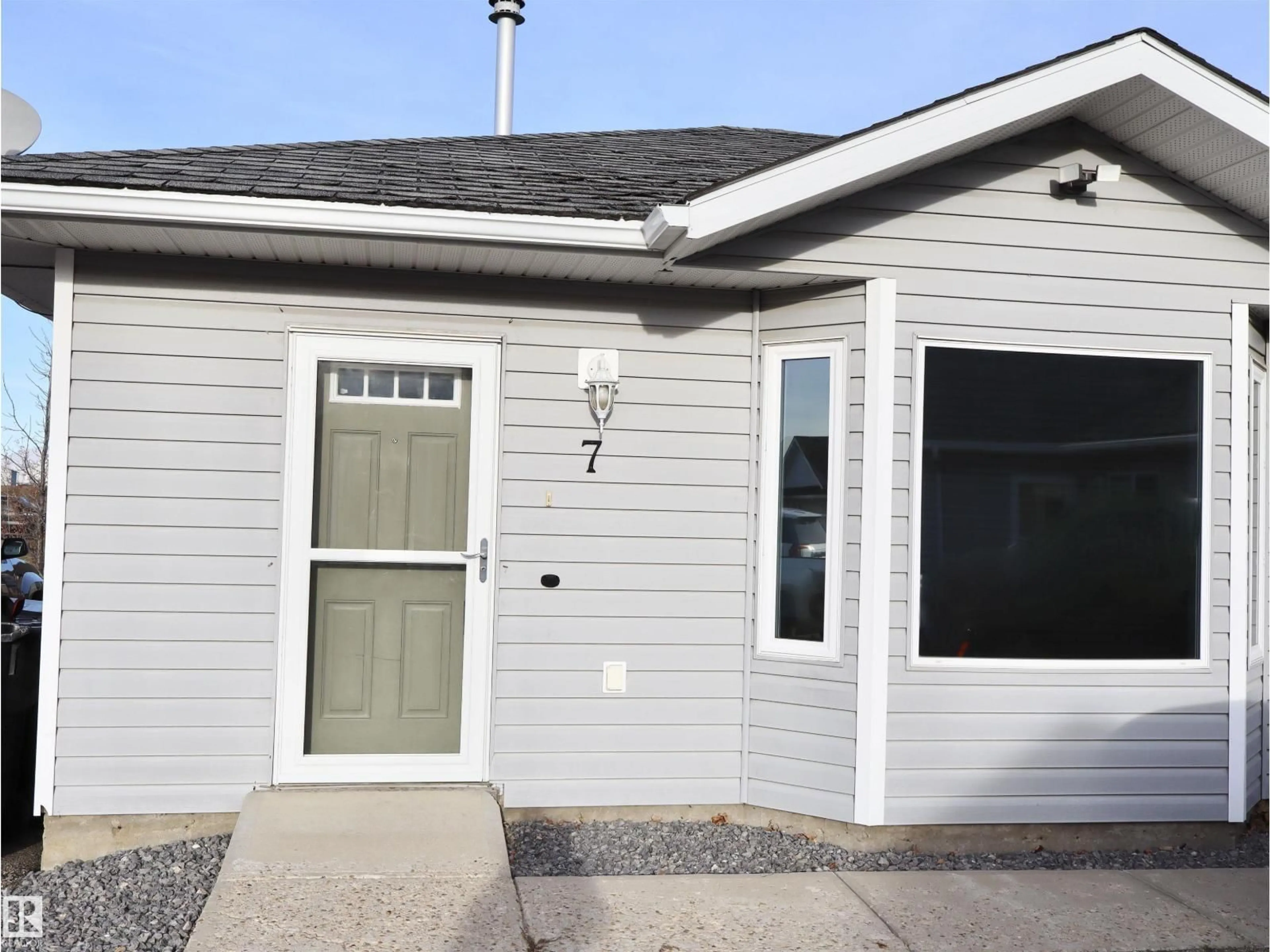 Home with vinyl exterior material, street for #7 - 5831 46 STREET, Barrhead Alberta T7N0A4