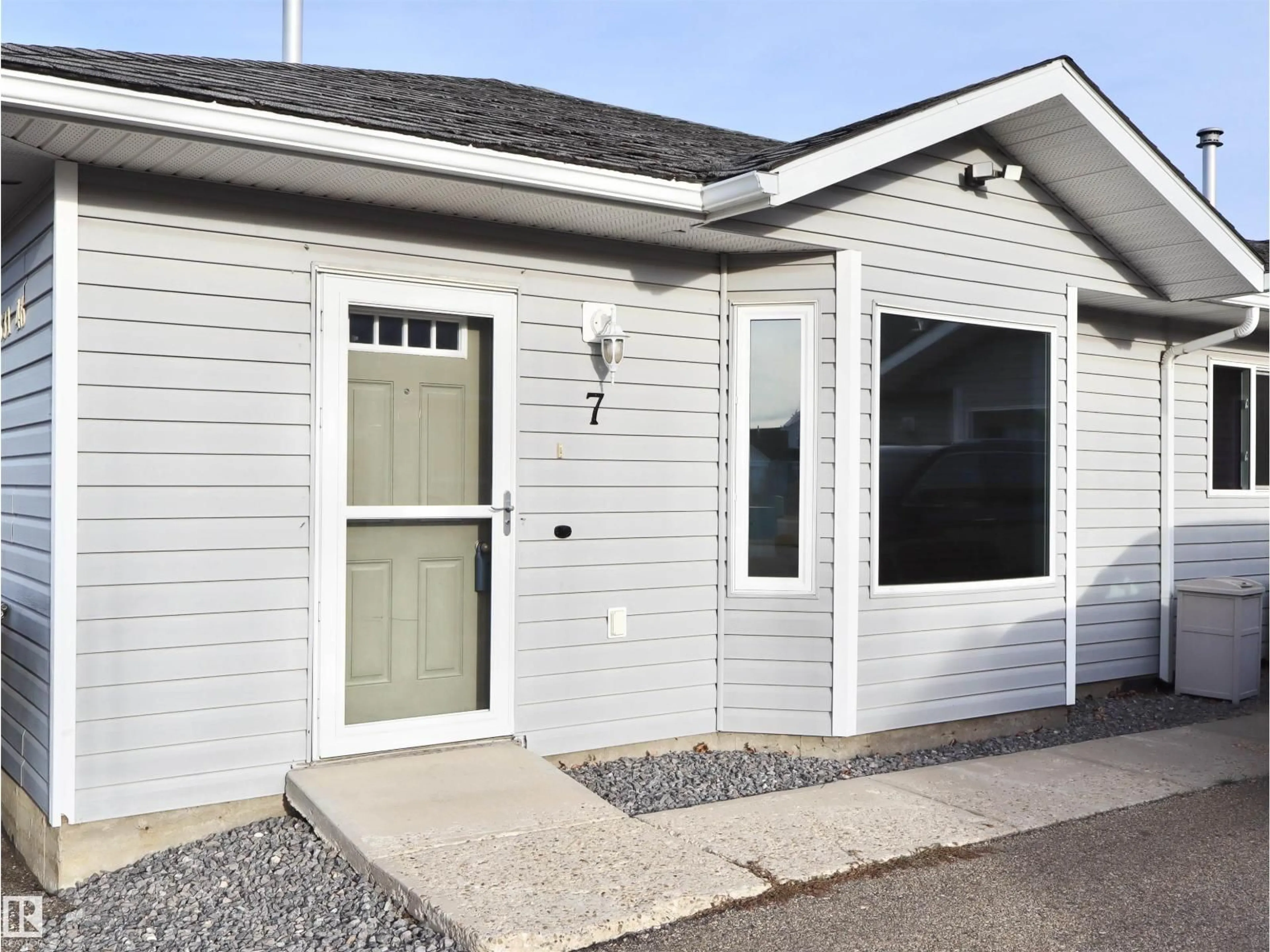Home with vinyl exterior material, street for #7 - 5831 46 STREET, Barrhead Alberta T7N0A4